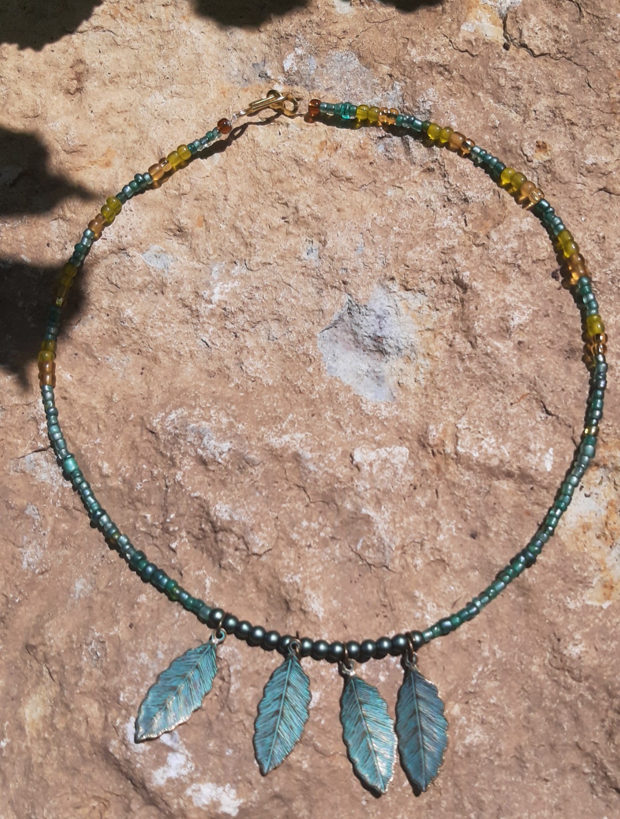 Handmade Jewelry Necklace w/ green and gold glass beads and metal leaves