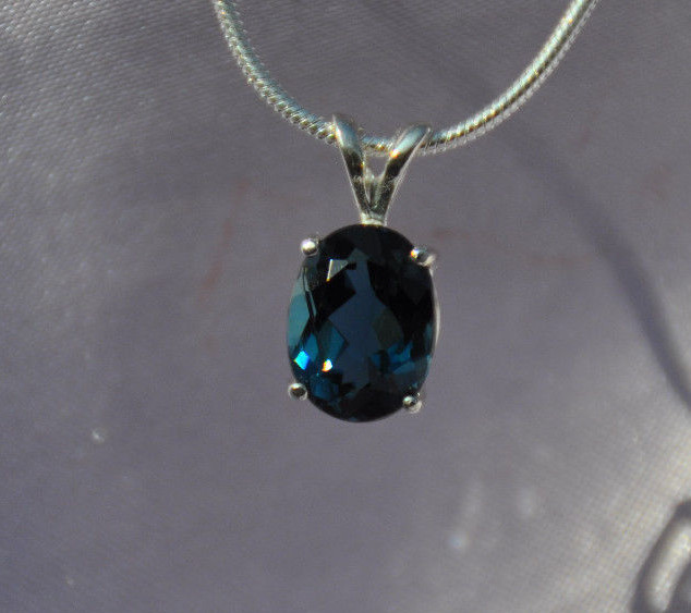 9mm X 7mm OVAL SHAPE LONDON BLUE TOPAZ PENDANT- .925 STERLING SILVER