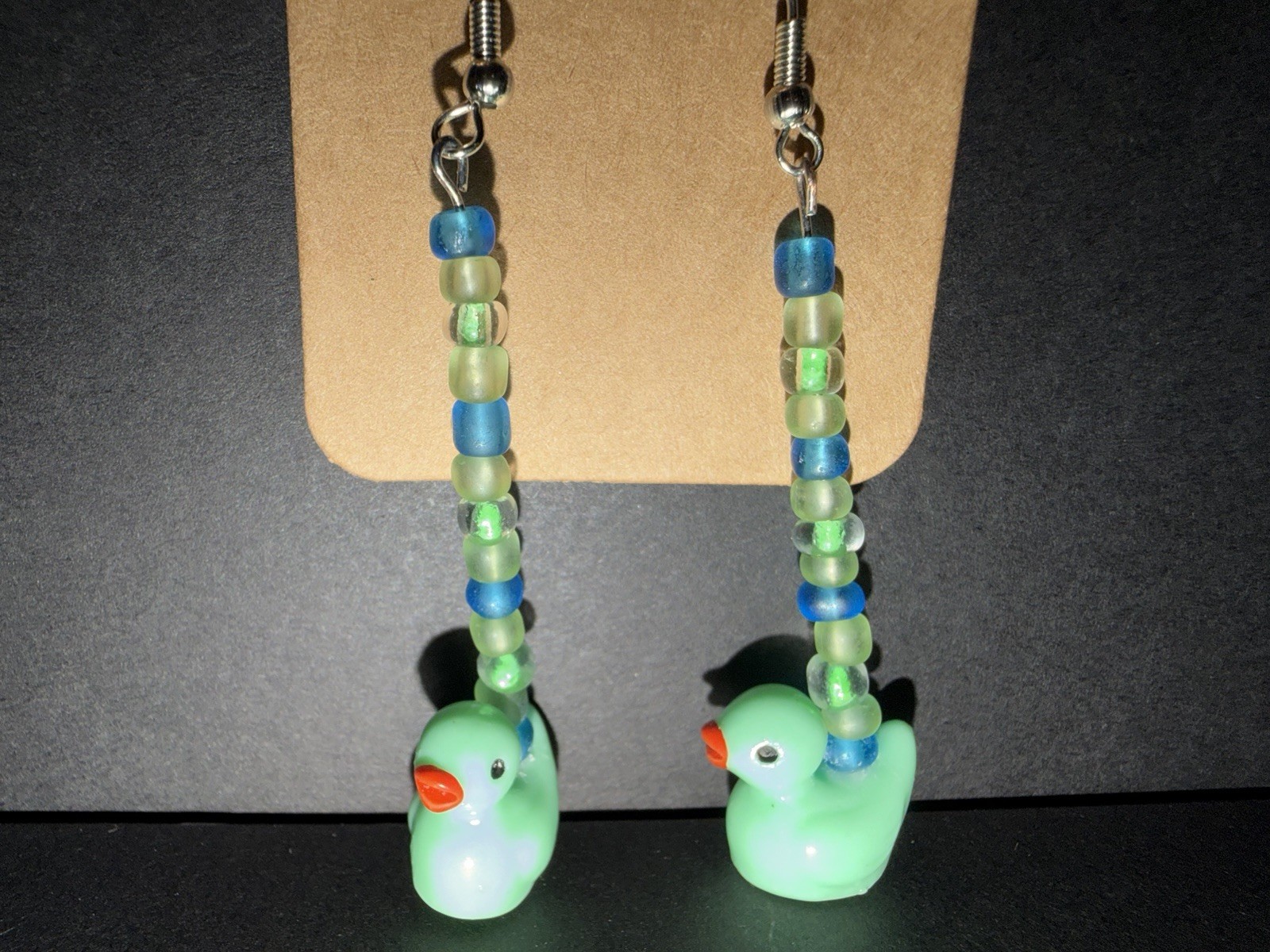 Handcrafted ooak mint duck dangle drop earrings with green and blue glass