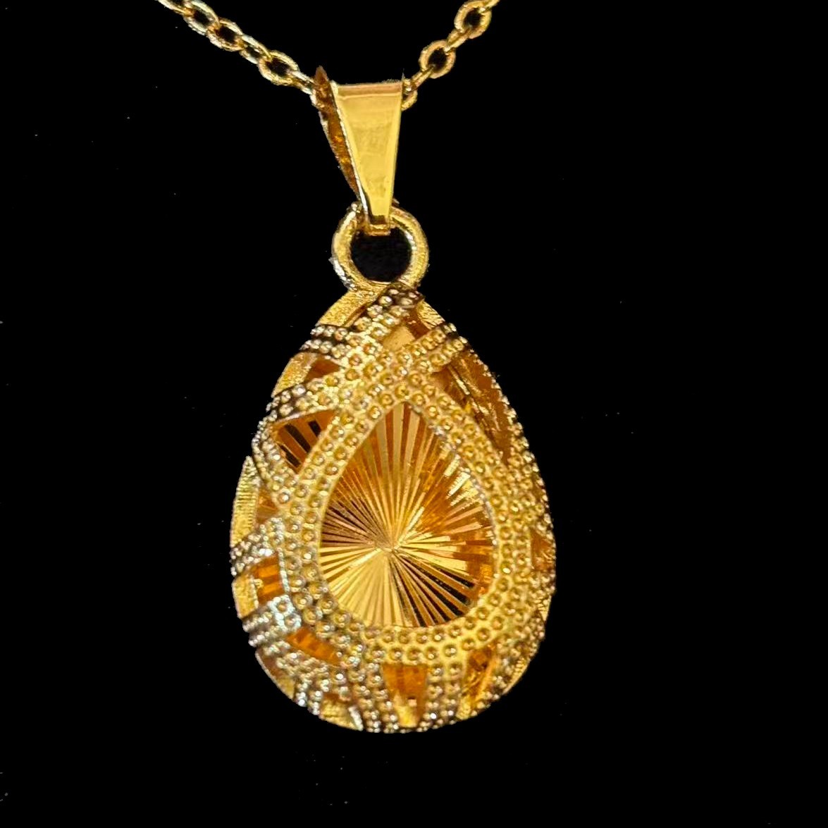 Gold-plated? Hollowed-out Gold Tone Pendant Necklace marked ‘999’, 19 in