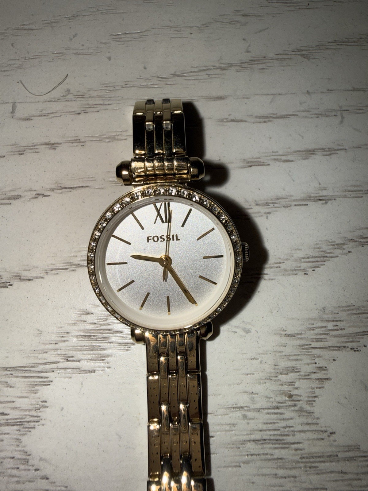 Fossil Women’s Analog Gold Tone Metal Bracelet Watch White Dial Gem-Set Bezel