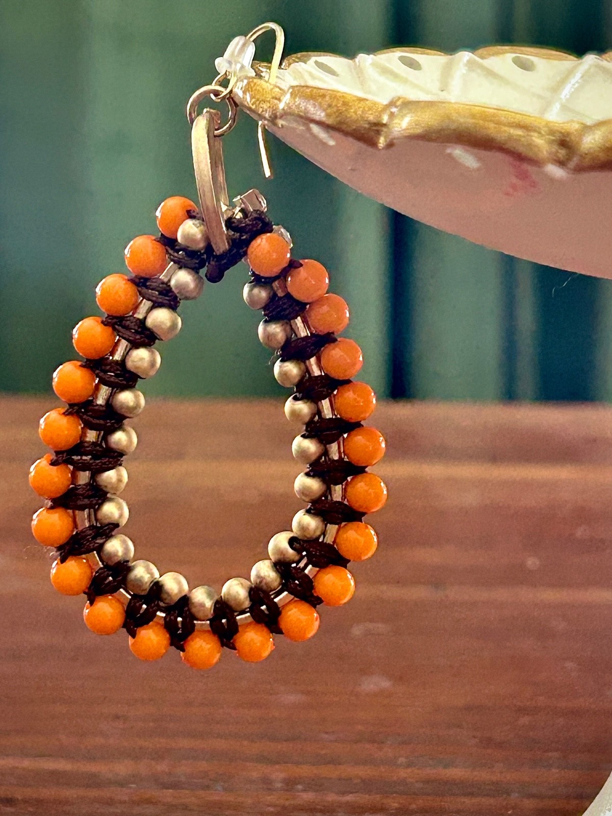 Orange beaded dangle earrings
