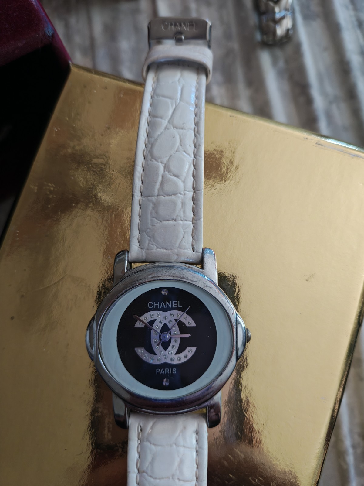 CHANEL Paris Quartz 23.9mm Stainless Steel Black Logo Dial White Leather Strap