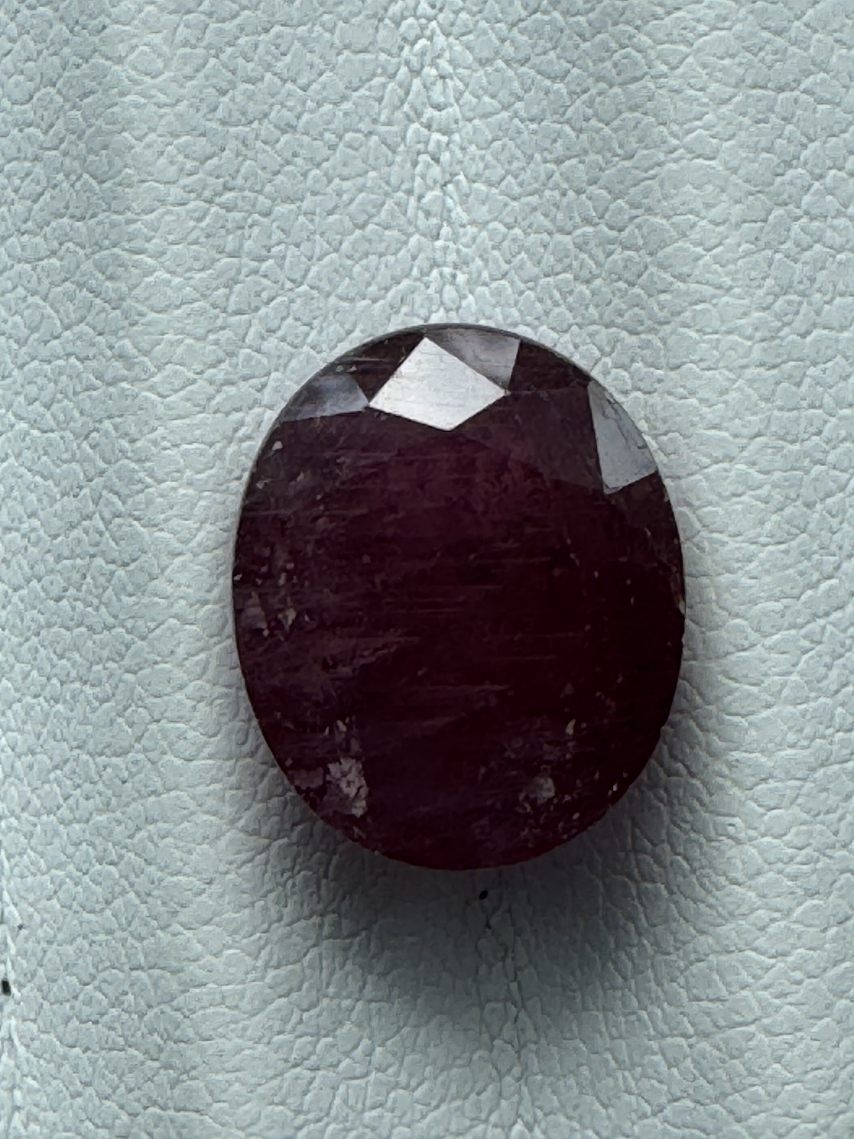 Dark Purple Red RUBY. 12 x 10 mm Oval, Slight Inclusion. 8.1 Carats.