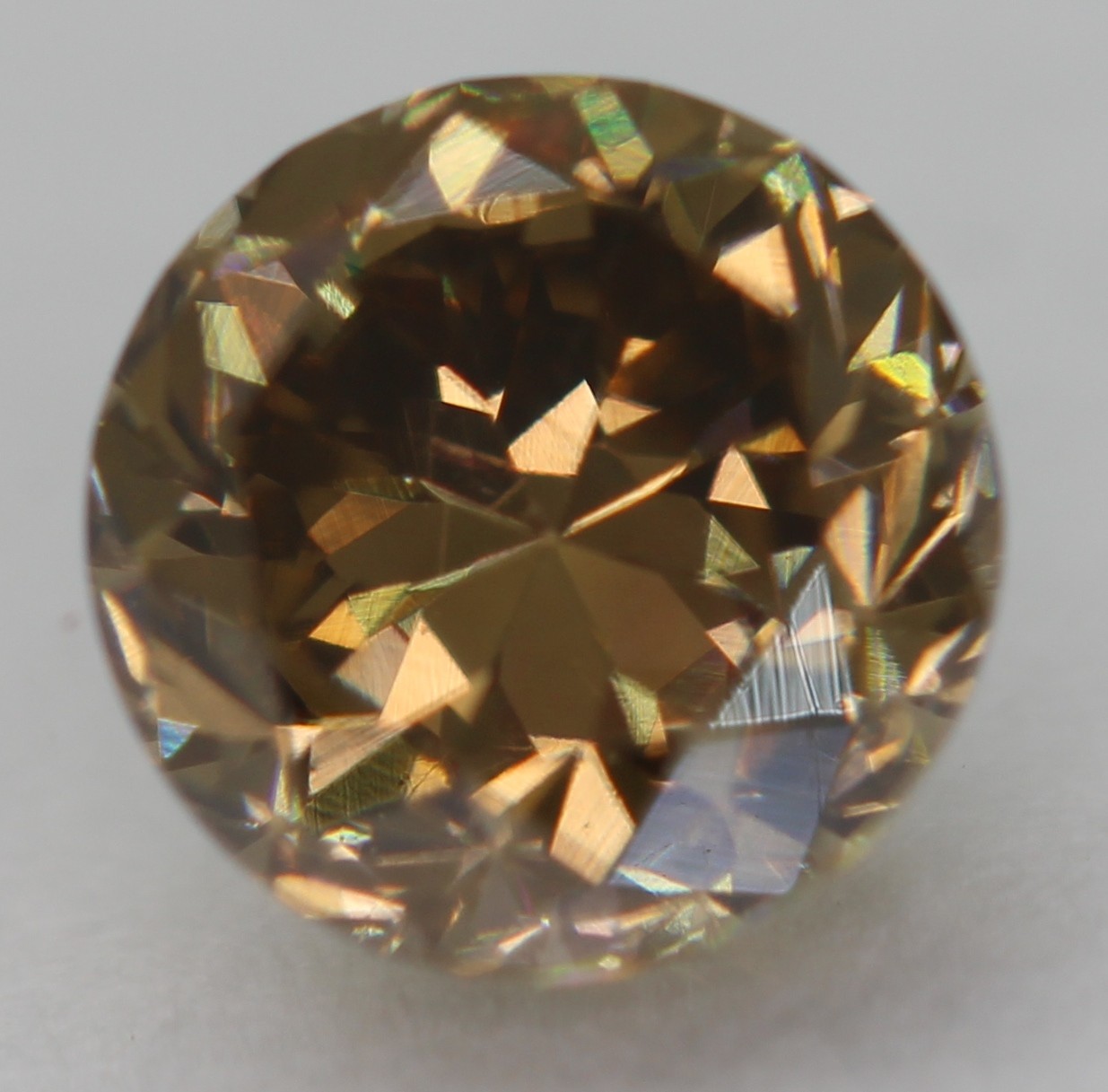 0.63 Ct Yellow Brown VVS2 Round Brilliant Natural Enhanced Diamond 5.18mm VIDEO