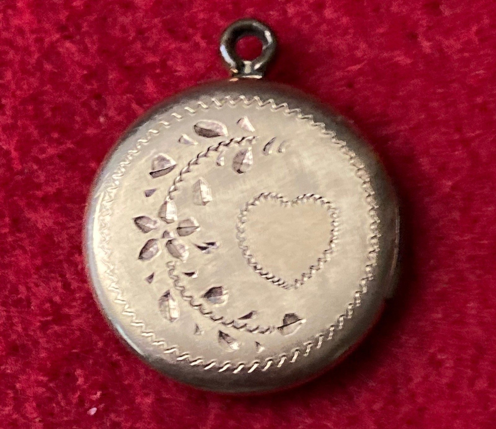 Vintage Gold Tone round locket features a hand-engraved crescent floral motif