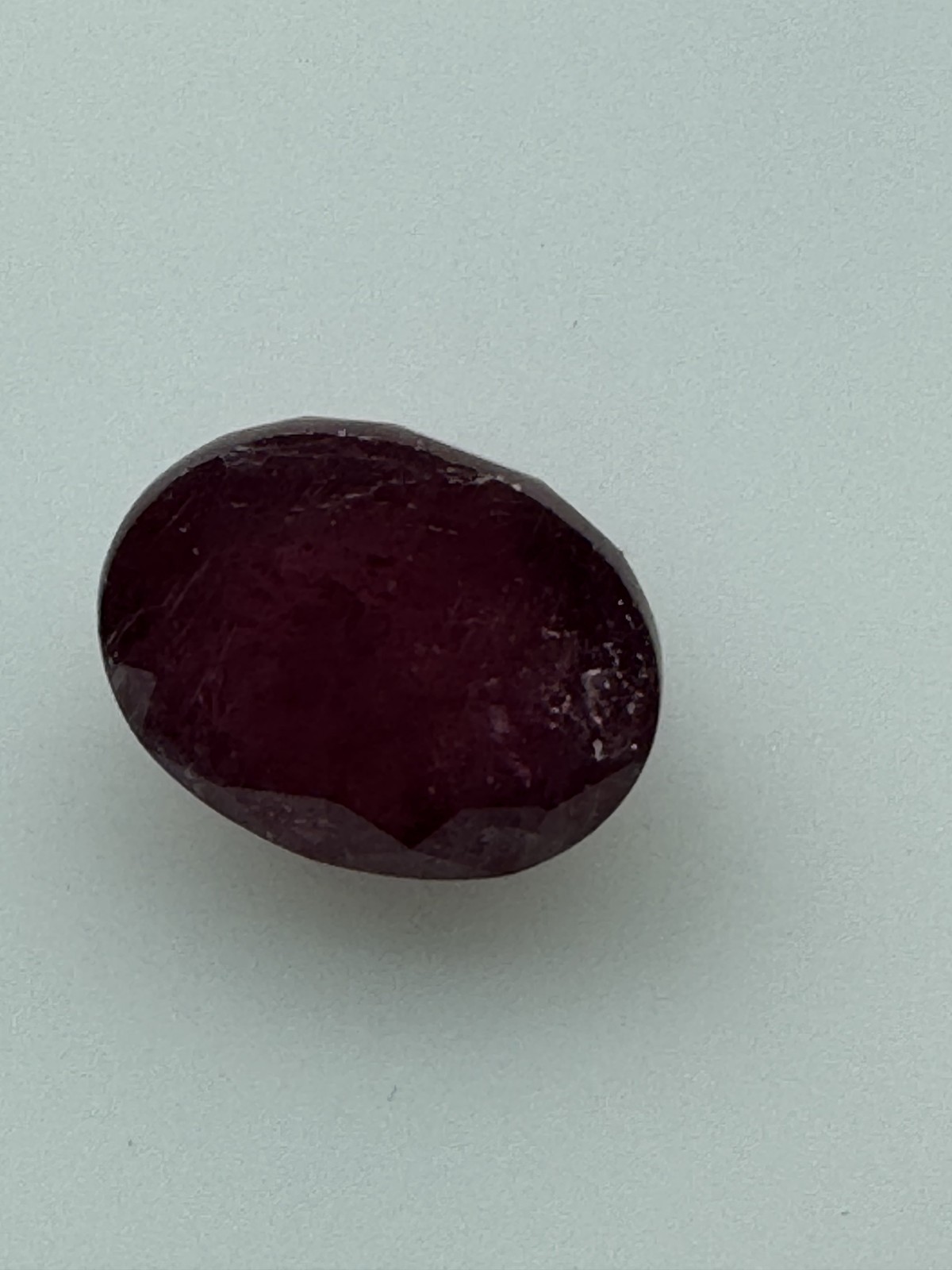 Dark Purple Red RUBY. 12 x 10 mm Oval, Slight Inclusion. 8.1 Carats.