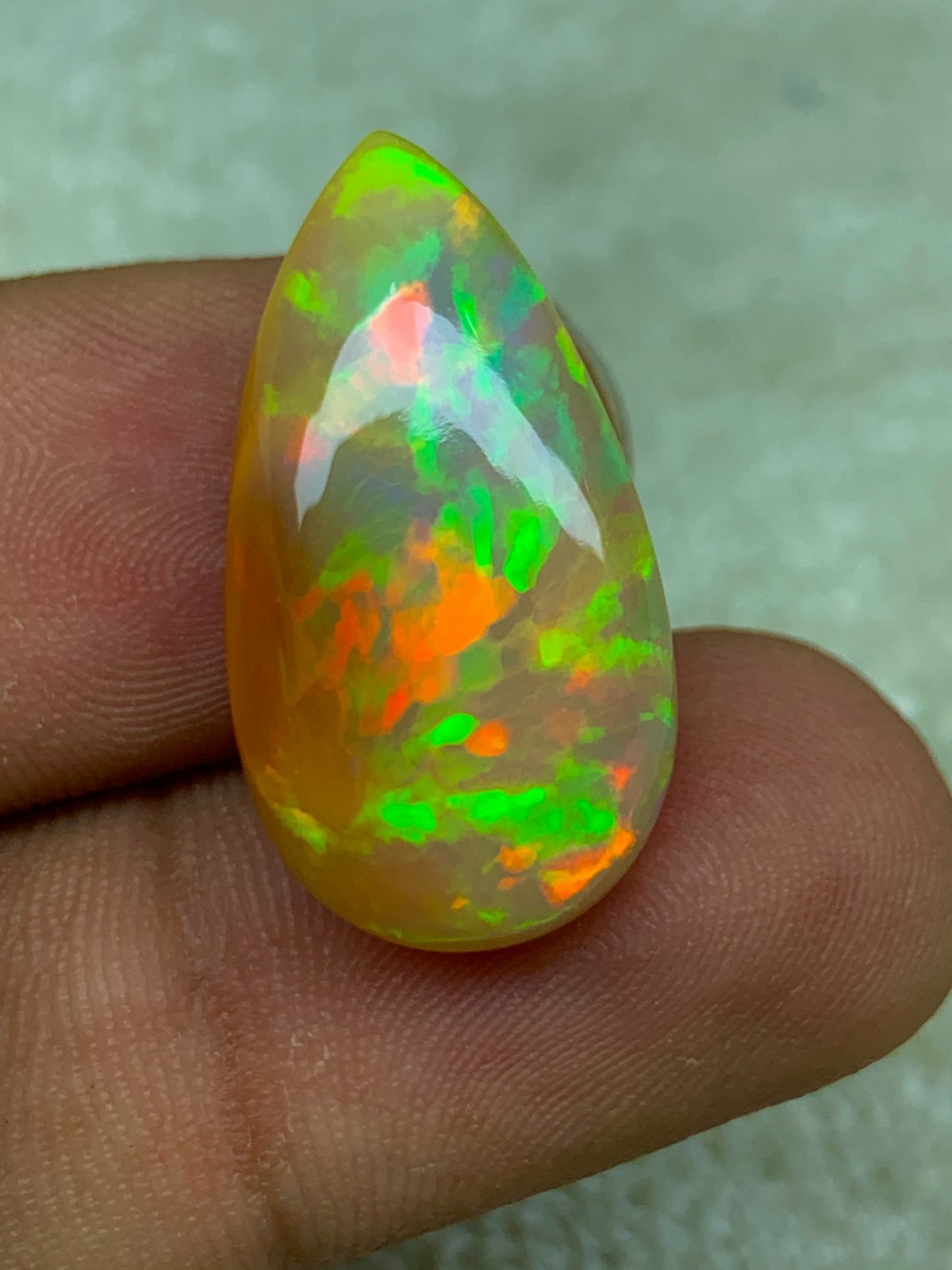 Natural Ethiopian Opal Honeycomb Pattern 14.90 Carat Multi-Fire Pear Cabochon