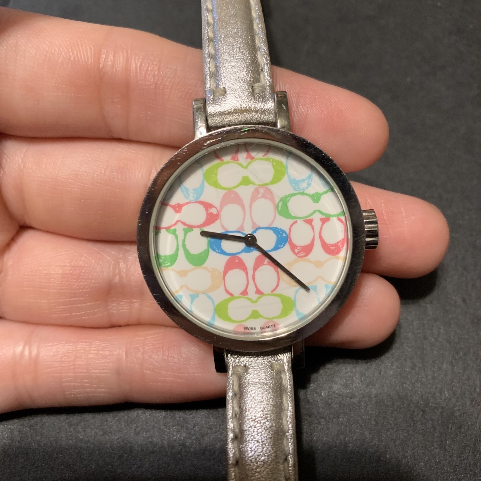 Coach Pastel Signature C watch featuring a white dial with a multicolor logo