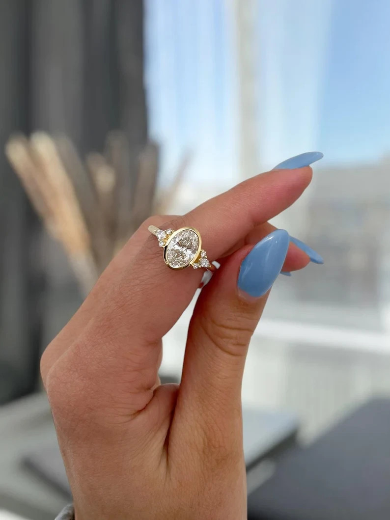 2CT Oval D/VVS1 Moissanite Bezel Engagement Ring In 14k Yellow Gold Plated