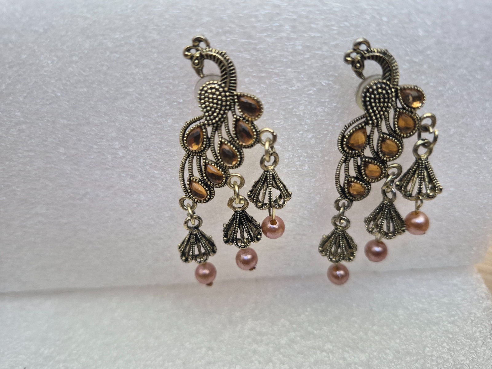 Peacock design Jhumka earrings for women with pearls and stone