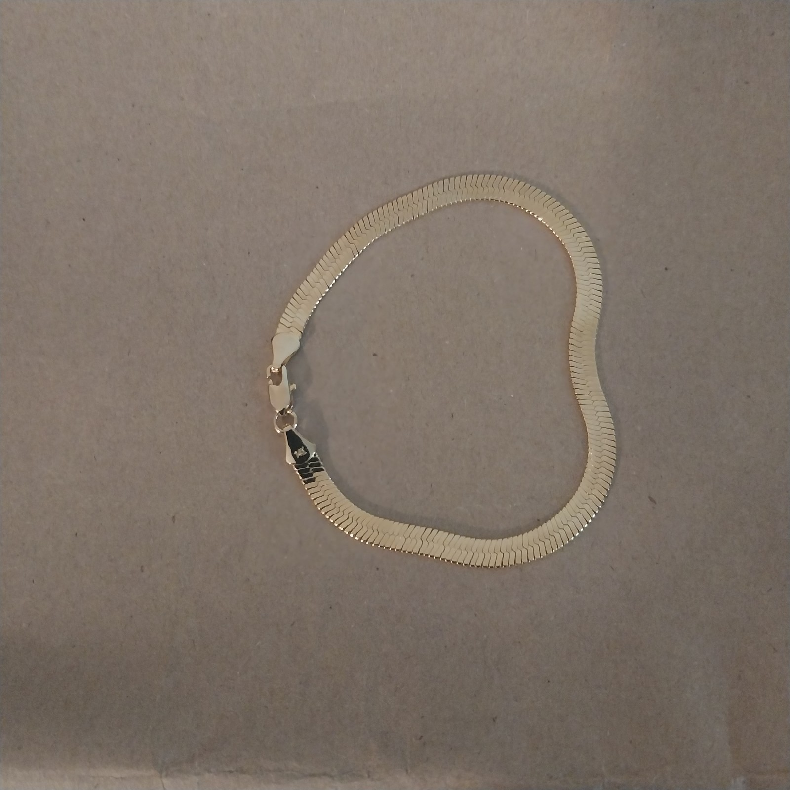 Gold herringbone bracelet
