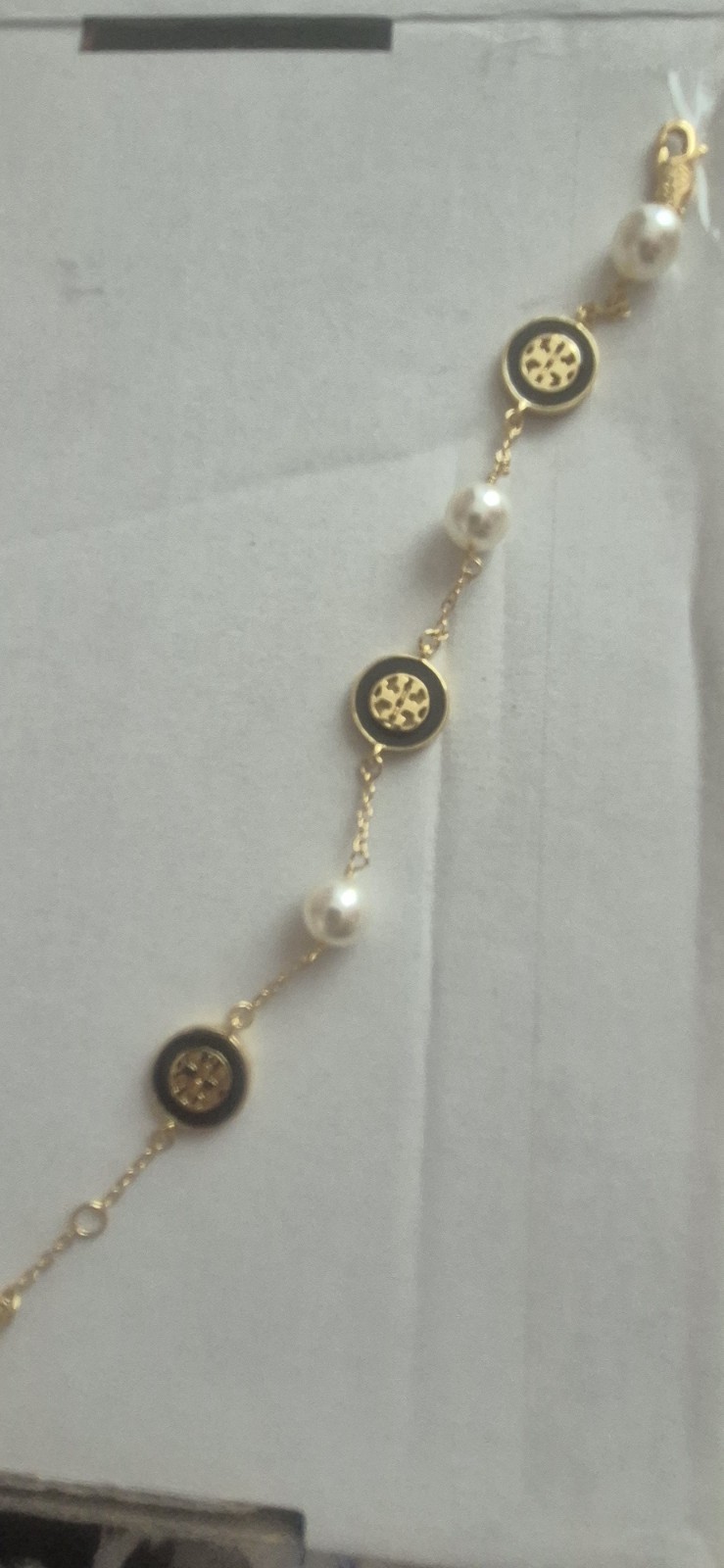 Tory Burch Kira pearl-chain bracelet features a delicate gold-tone chain