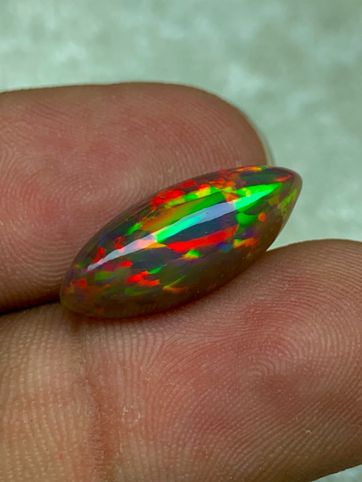 Shewa Chocolate Ethiopian Opal Gemstone 4.55 Carat Multi-Fire Marquise Cabochon