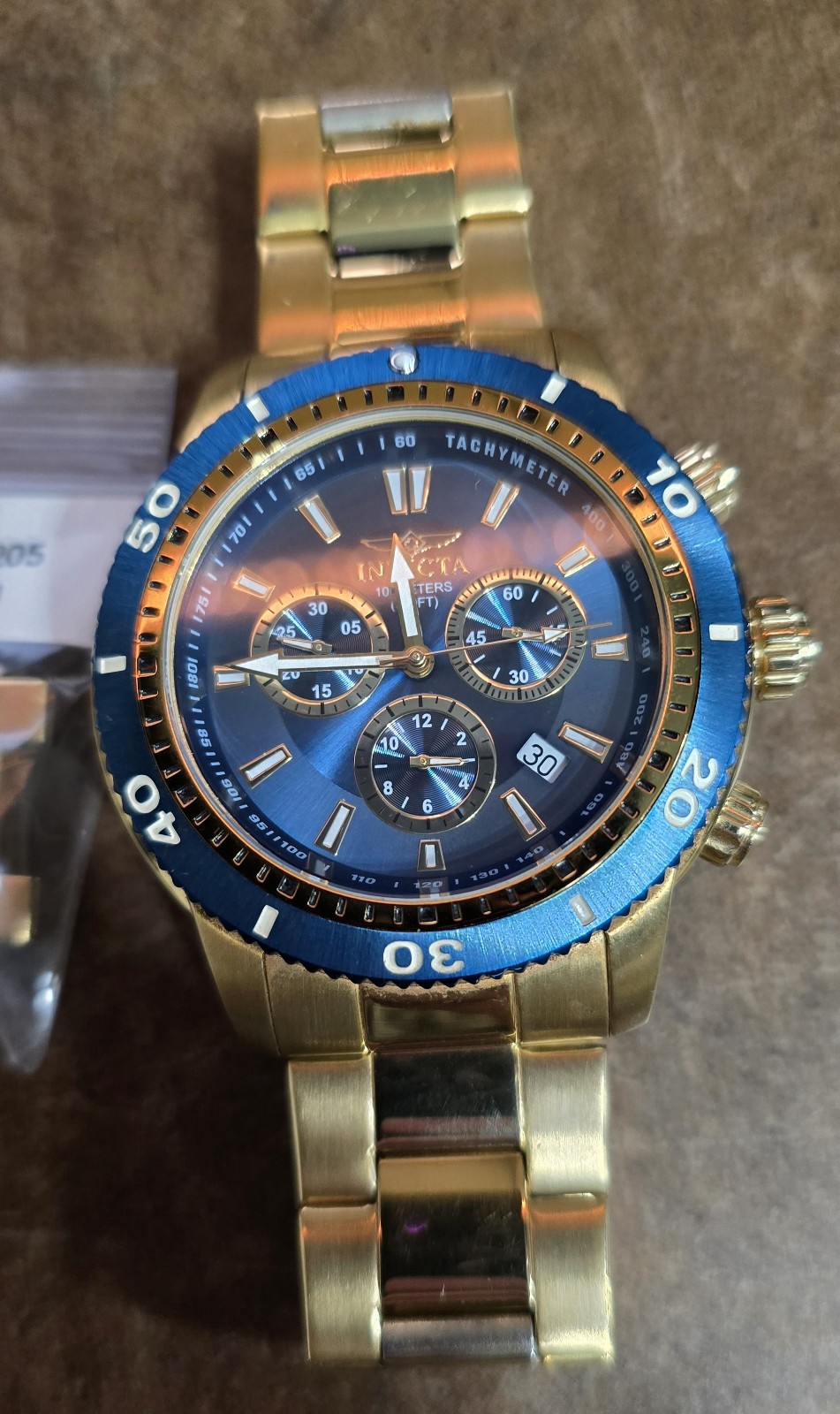 Invicta Men’s Watch Model 1205 chronograph gold with blue dial and bezel