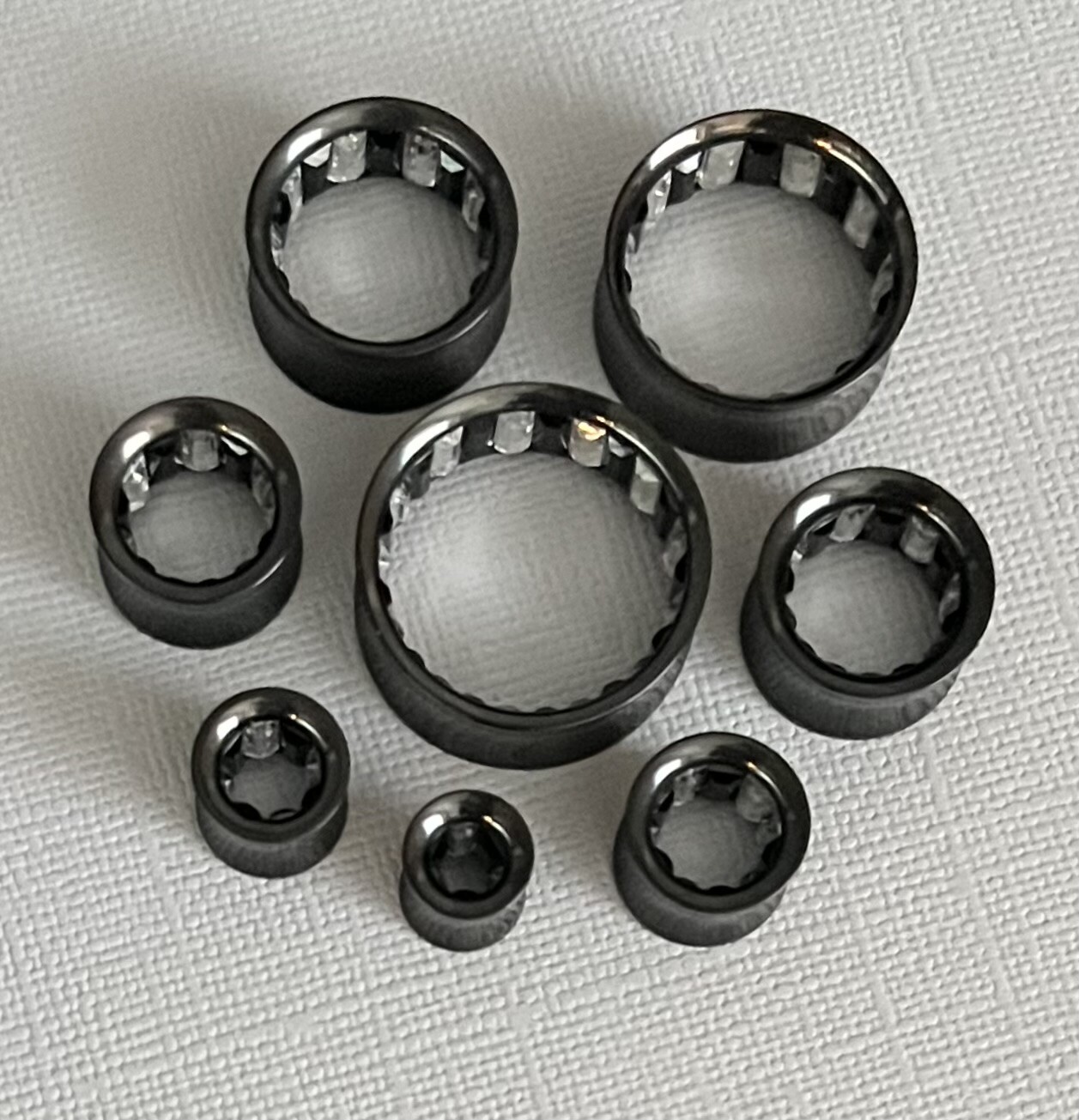 PAIR Inner Clear / Black Gem Black Ion Plated Steel Saddle Tunnels Plugs Gauges