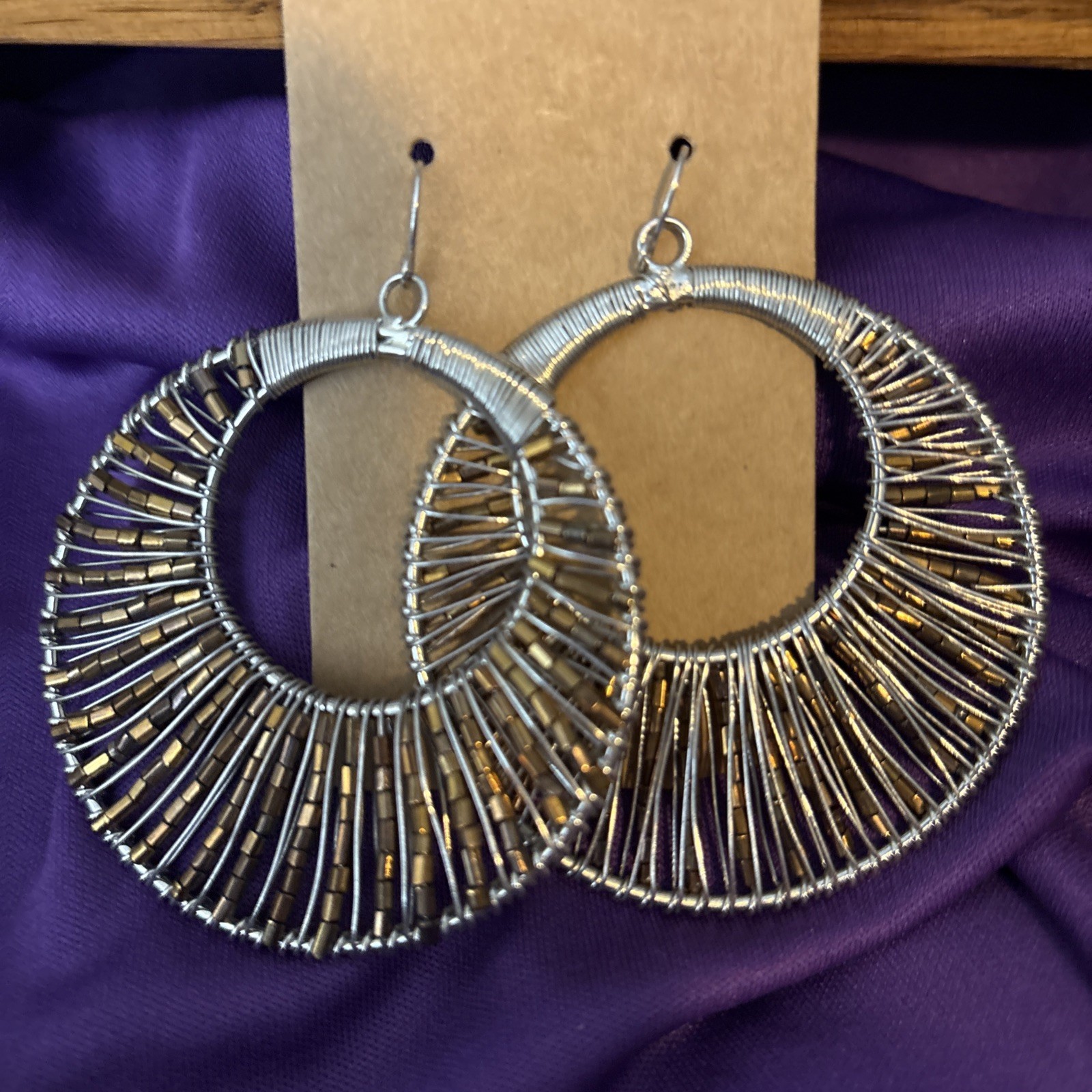 large silver wire wrapped hoop earrings w/ pewter beads.