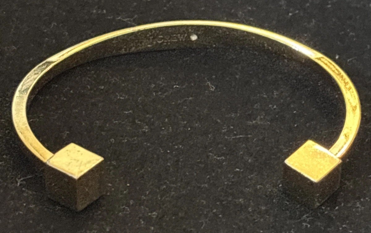J.Crew gold-tone cuff bracelet two small cubes at the open ends.