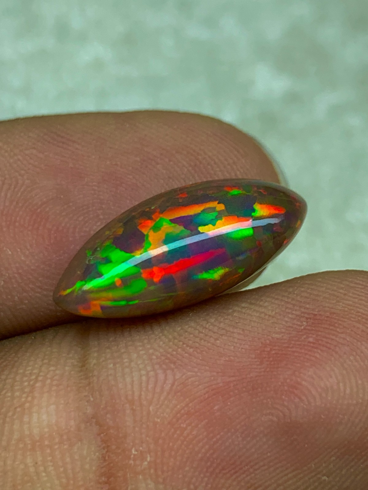 Shewa Chocolate Ethiopian Opal Gemstone 4.55 Carat Multi-Fire Marquise Cabochon
