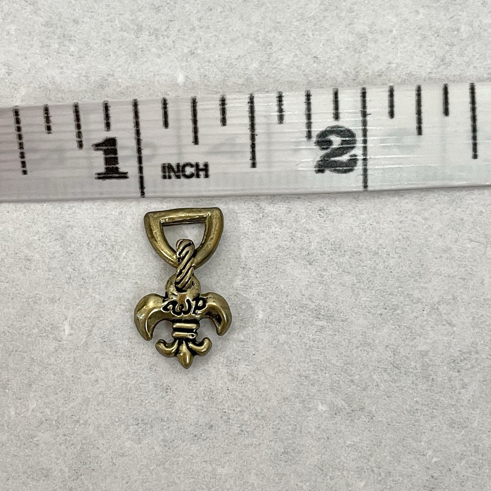 Waxing Poetic Brass Fleur de Lis Small Charm