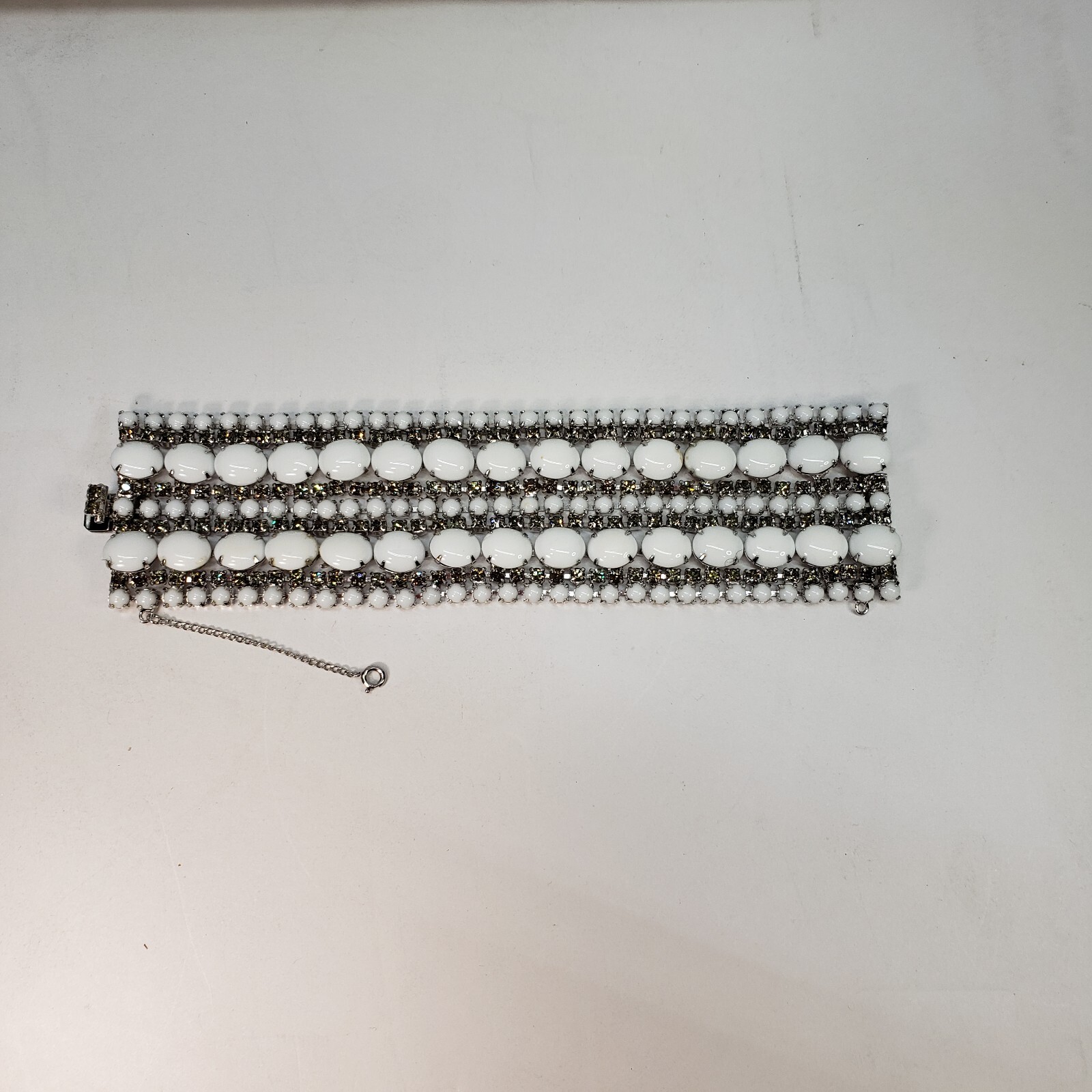 Milk Glass Bracelet With Crystal Rhinestones, 9 Rows. 7in Long 2in Wide