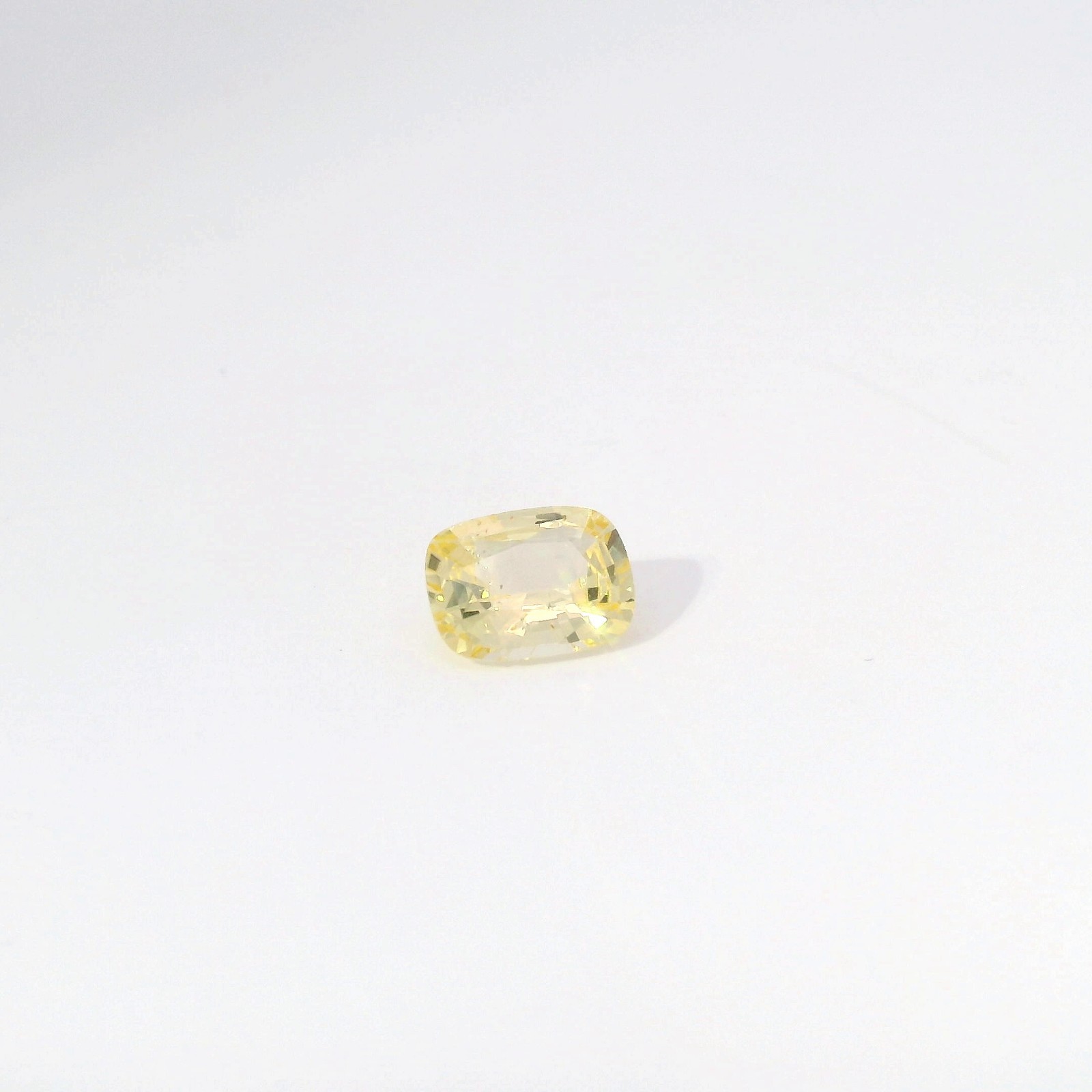 1.51ct Cushion Cut Yellow Sapphire Corrundum. Inclusions Throughout