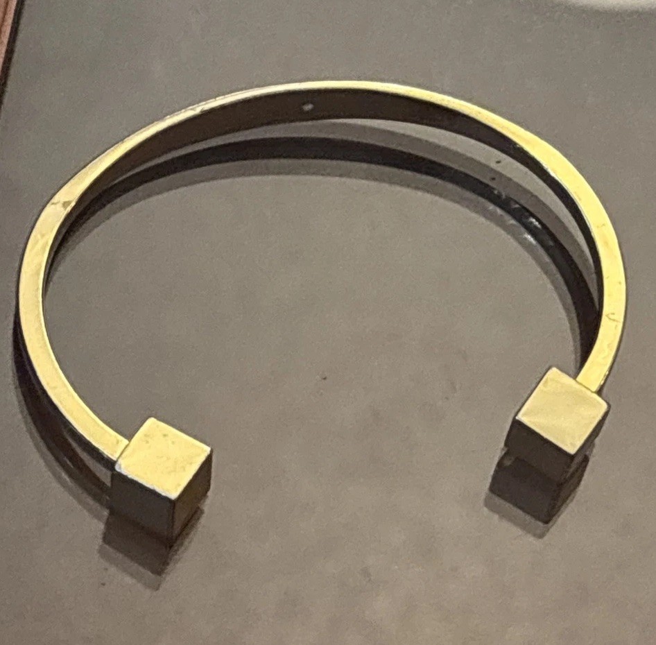 J.Crew gold-tone cuff bracelet two small cubes at the open ends.