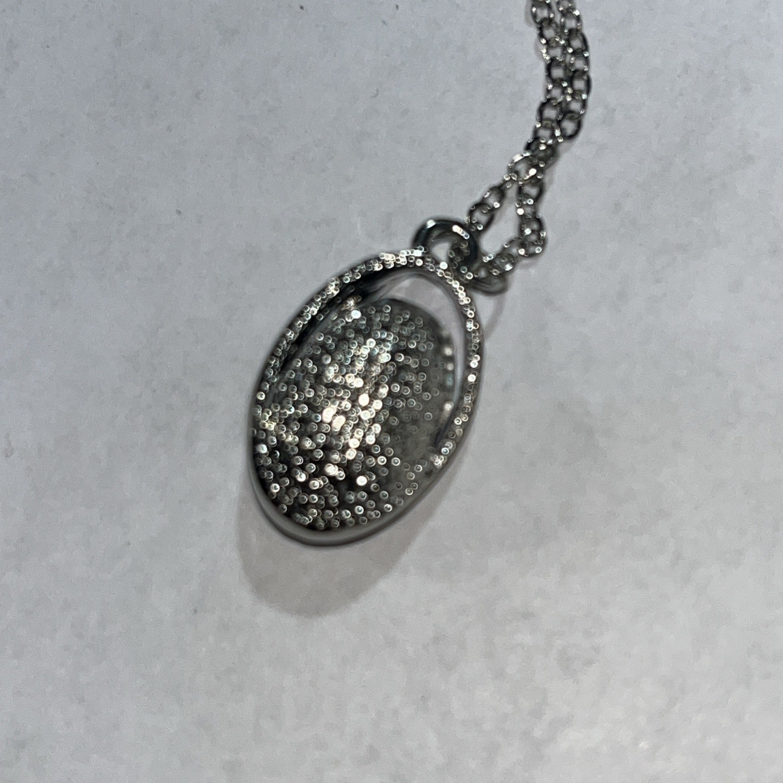 Blue rhinestone necklace in silvertone cage 14″ adjustable