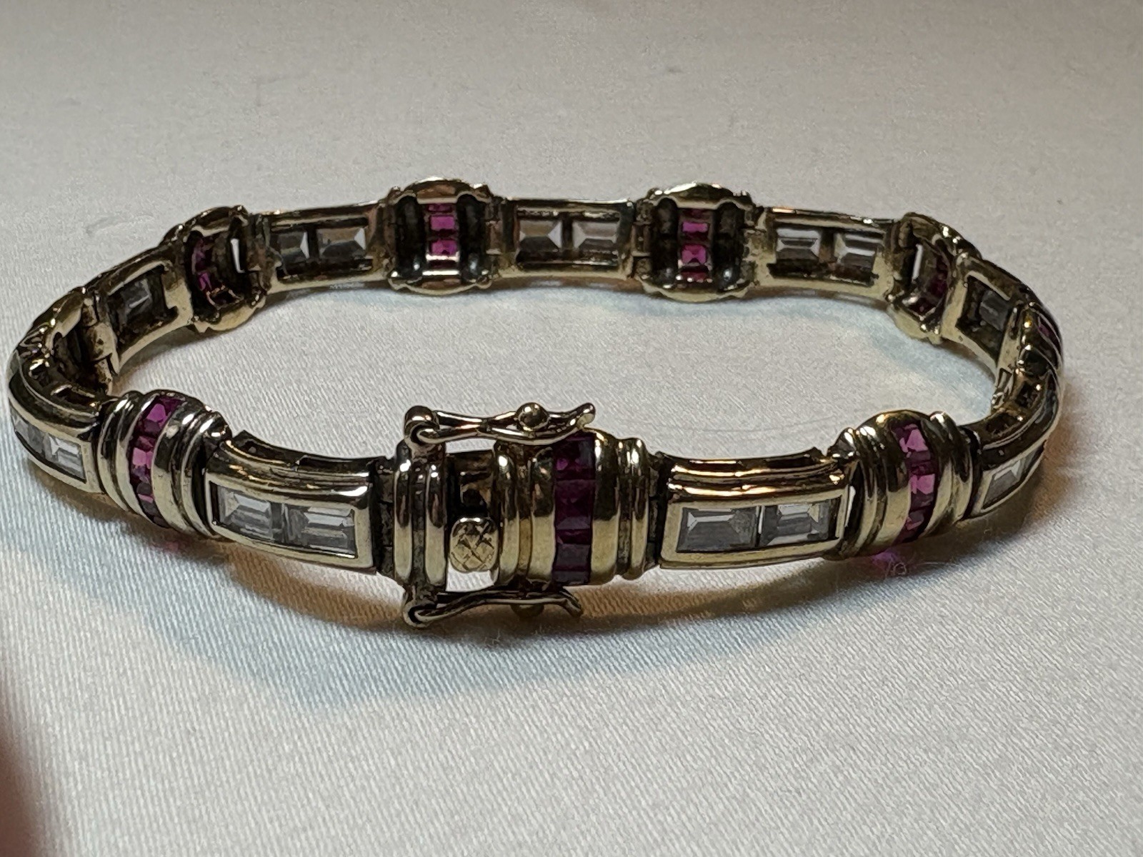 A sterling silver bracelet featuring baguette and round cubic zirconia stones.