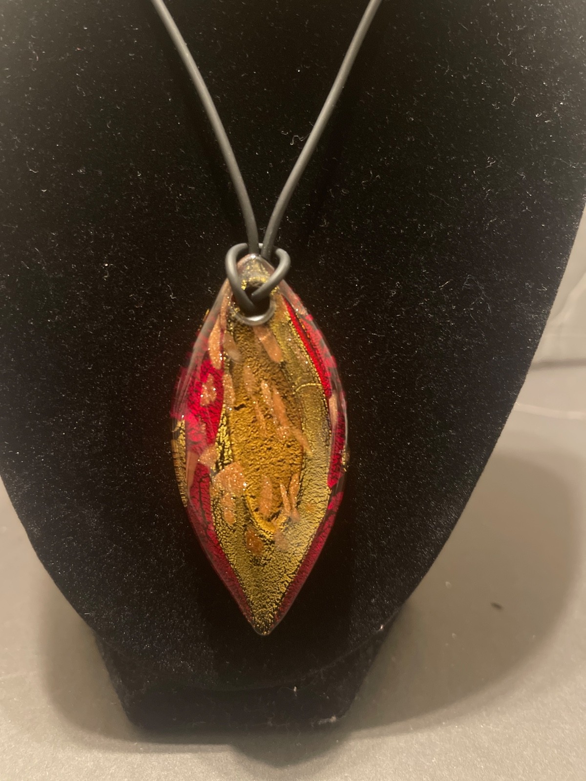 Multicolor handblown glass pendant necklace. Red, gold, copper and black.