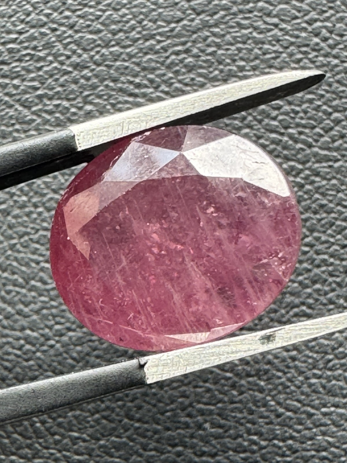 Dark Purple Red RUBY. 12 x 10 mm Oval, Slight Inclusion. 8.1 Carats.