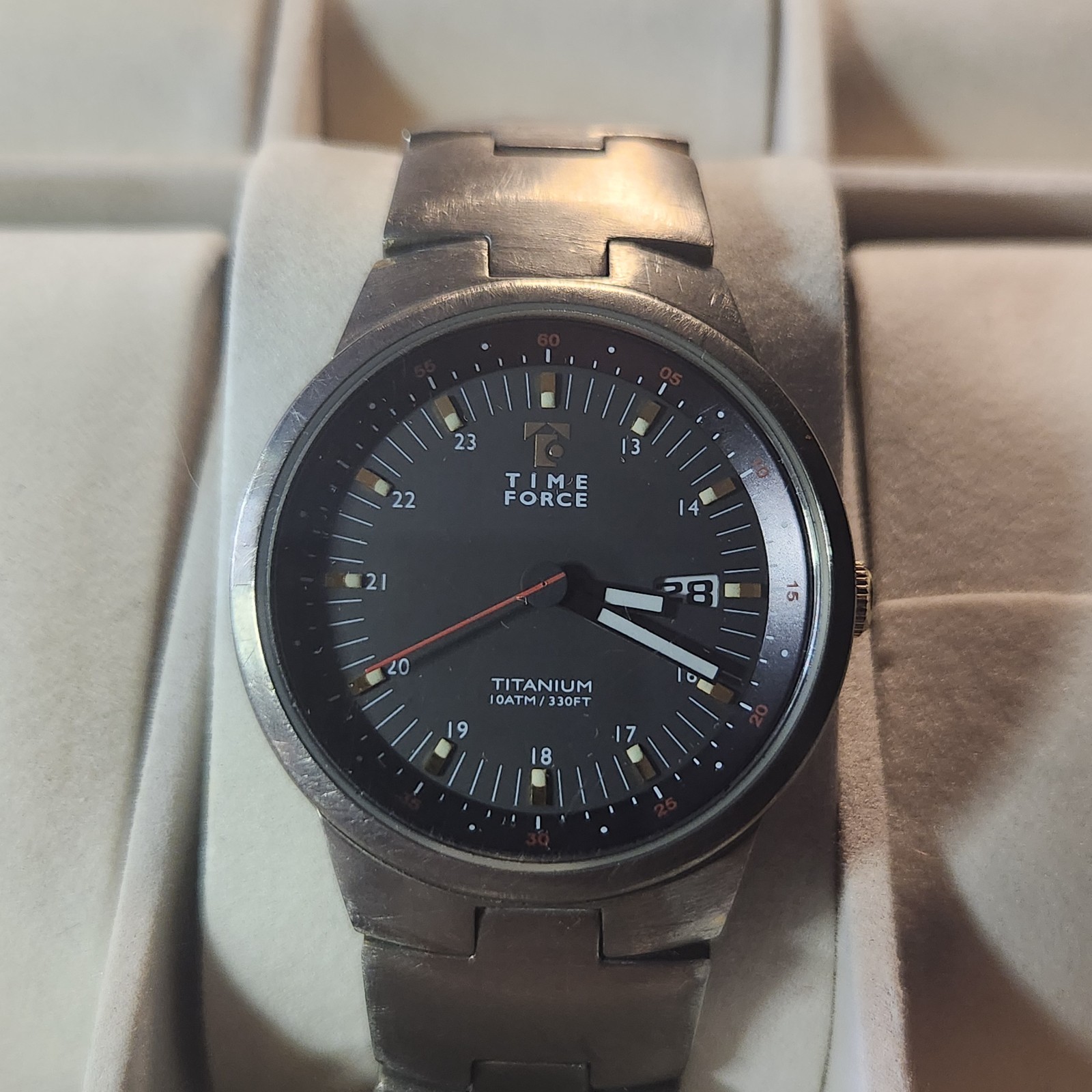 Time Force titanium wristwatch features a 10ATM/330FT water resistance