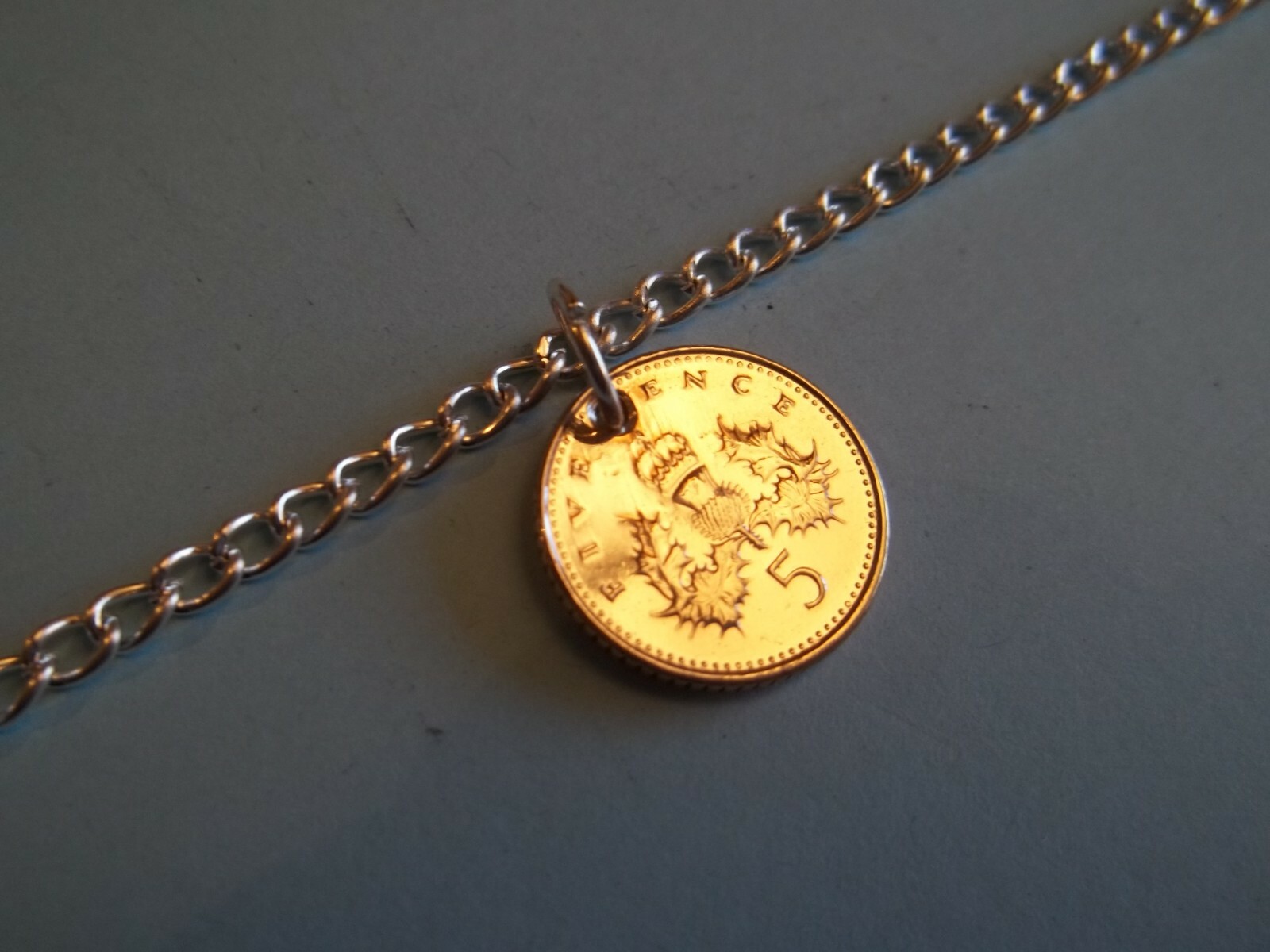 FIVE (5) PENCE COIN PENDANT BRACELET – SILVER CURB CHAIN – 1990 to 2008