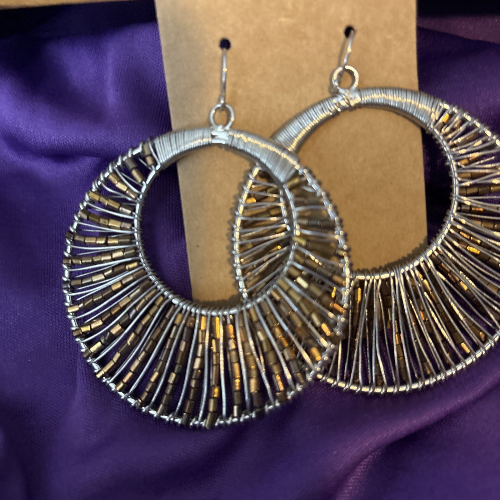 large silver wire wrapped hoop earrings w/ pewter beads.