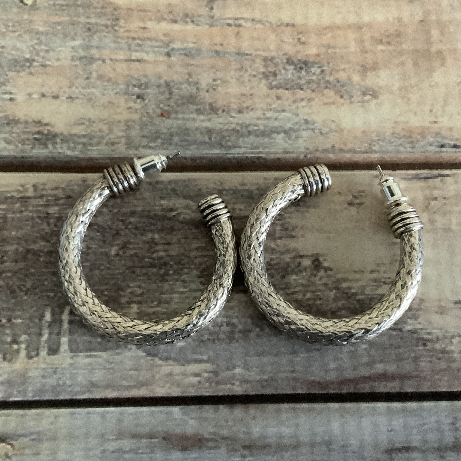 Pierced silver tone braided mesh wire hoop earrings