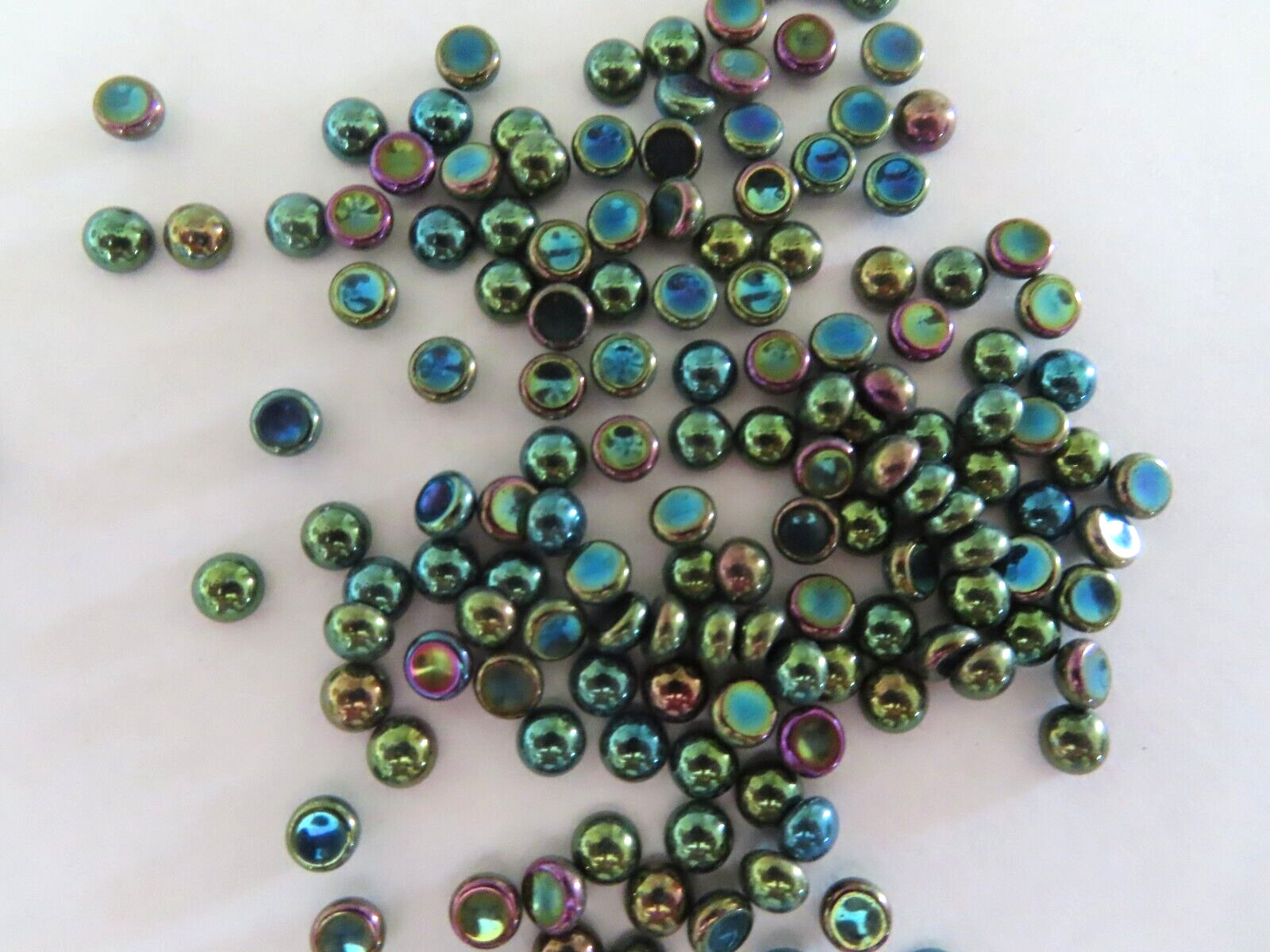 144 Czech. Glass round Cabochones in 5mm Green Iris.