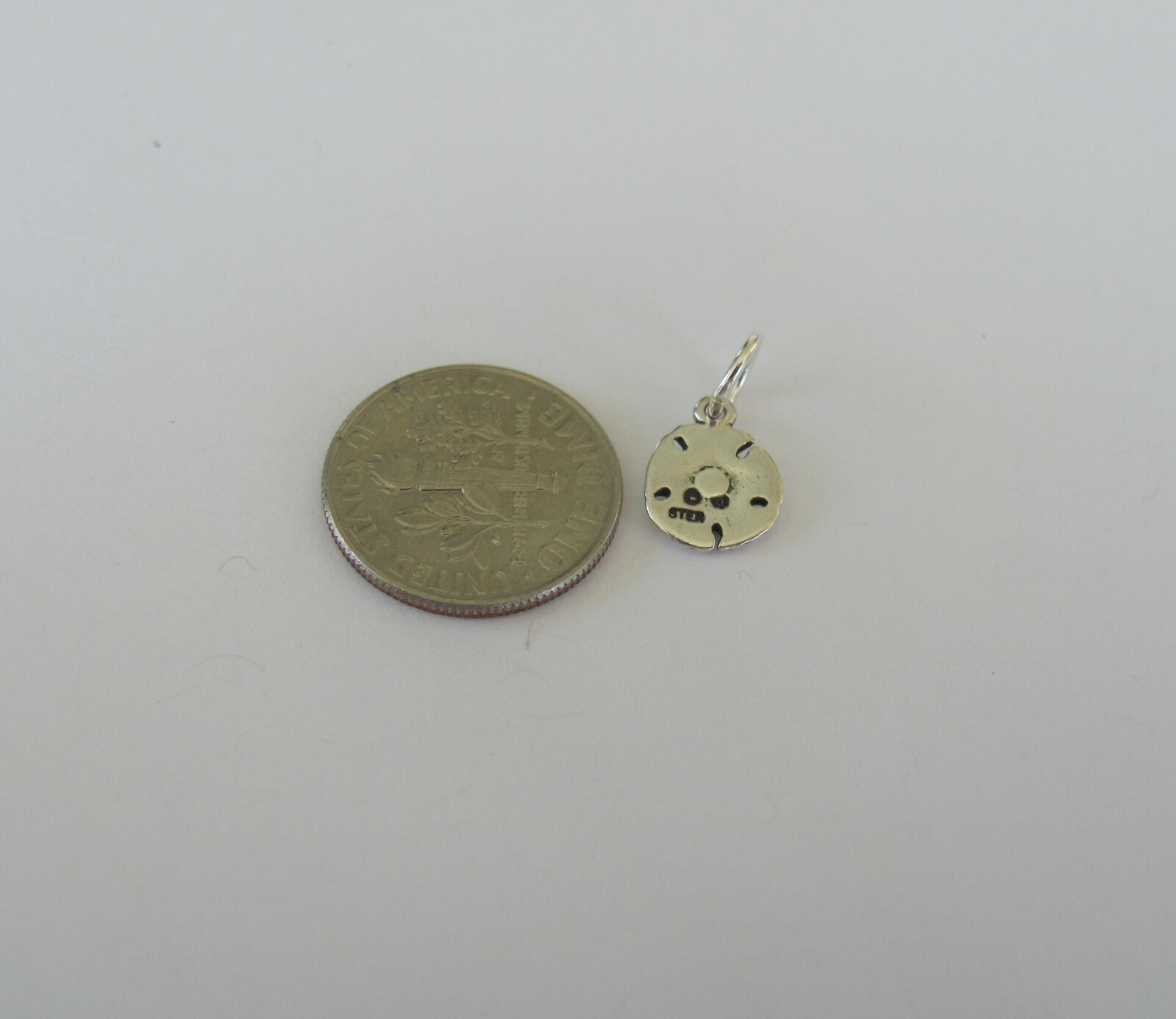 Very small Sterling Silver Sand dollar mini tiny charm.