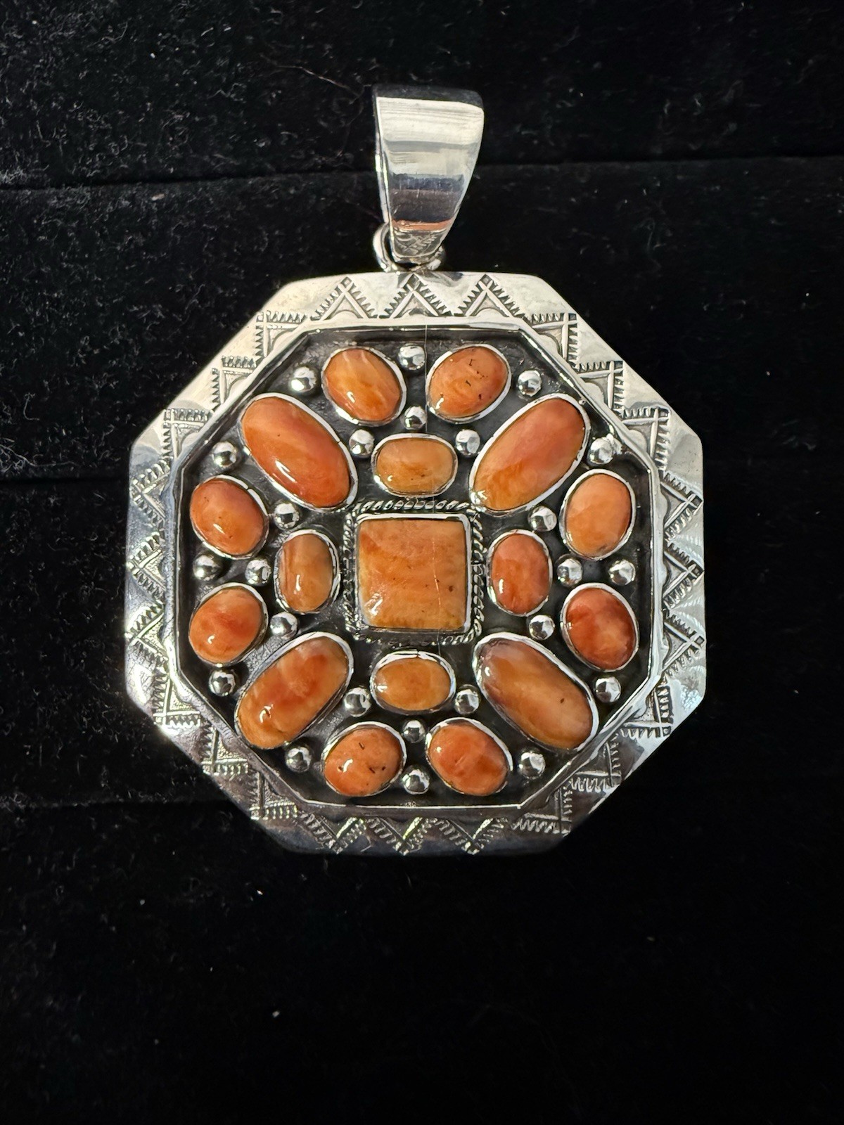 Handcrafted authentic Kenneth Jones Navajo orange spiny cluster pendant