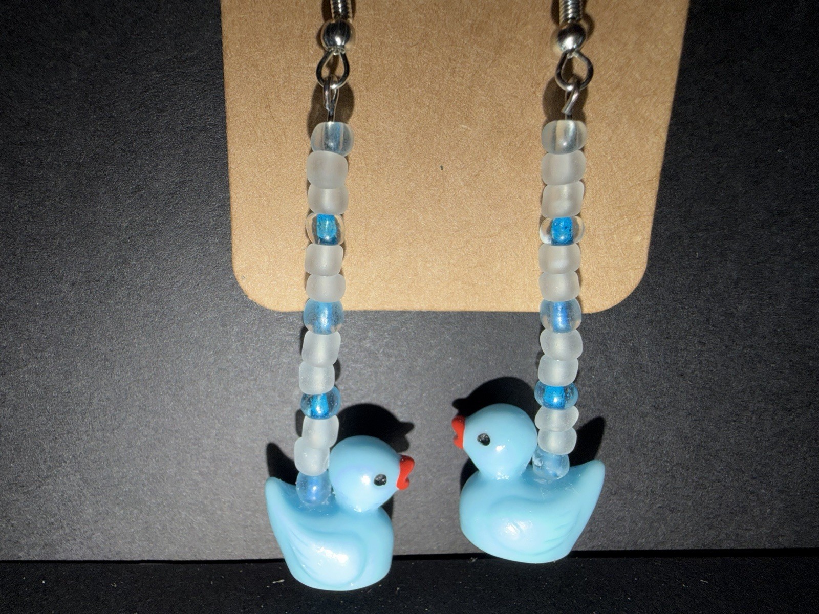 Handcrafted ooak blue dangle drop duck earrings with frosted glass beads