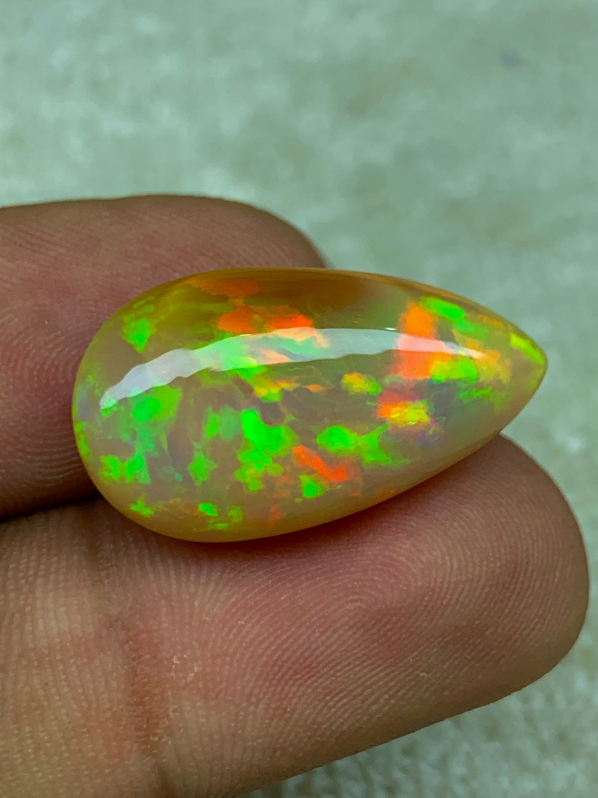 Natural Ethiopian Opal Honeycomb Pattern 14.90 Carat Multi-Fire Pear Cabochon