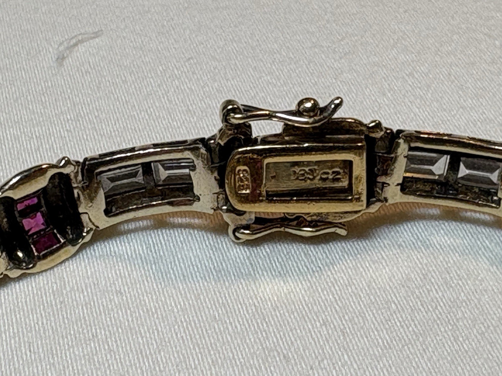 A sterling silver bracelet featuring baguette and round cubic zirconia stones.