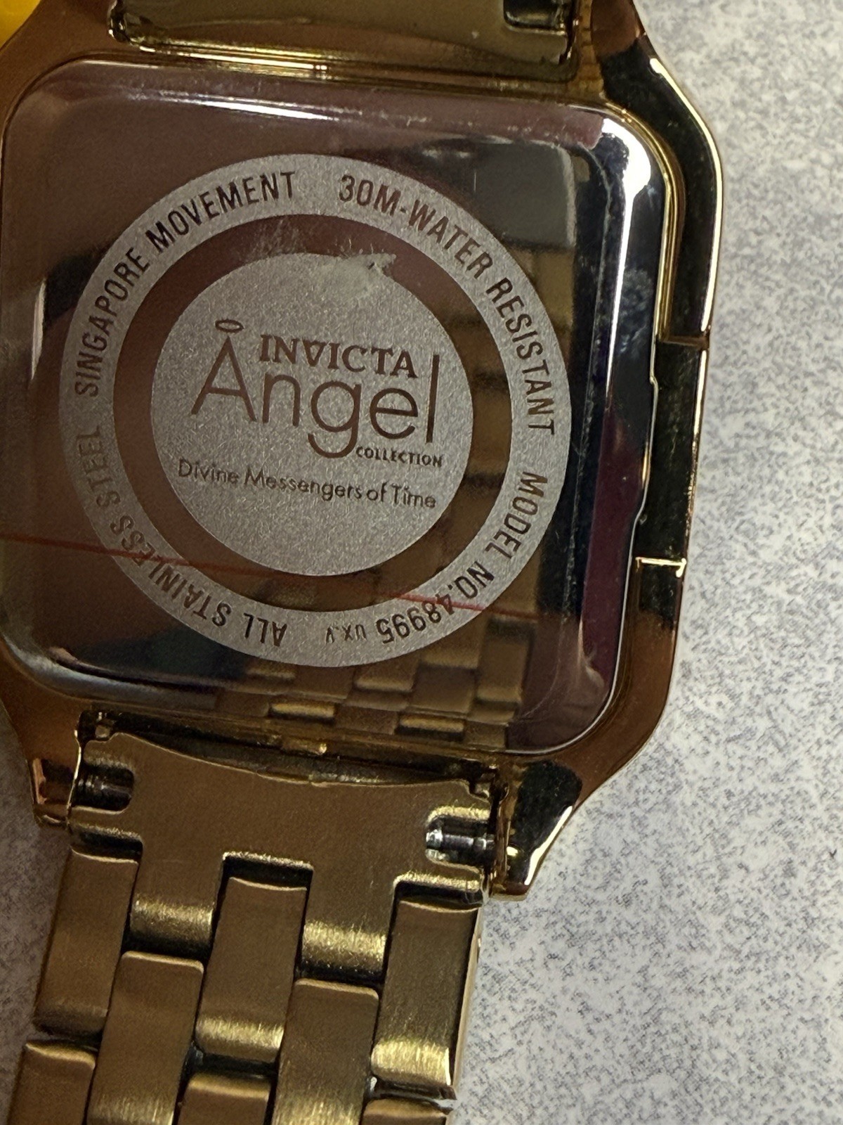 Invicta Angel Gold Crystal Bezel Rectangular White Roman Dial Watch 28mm