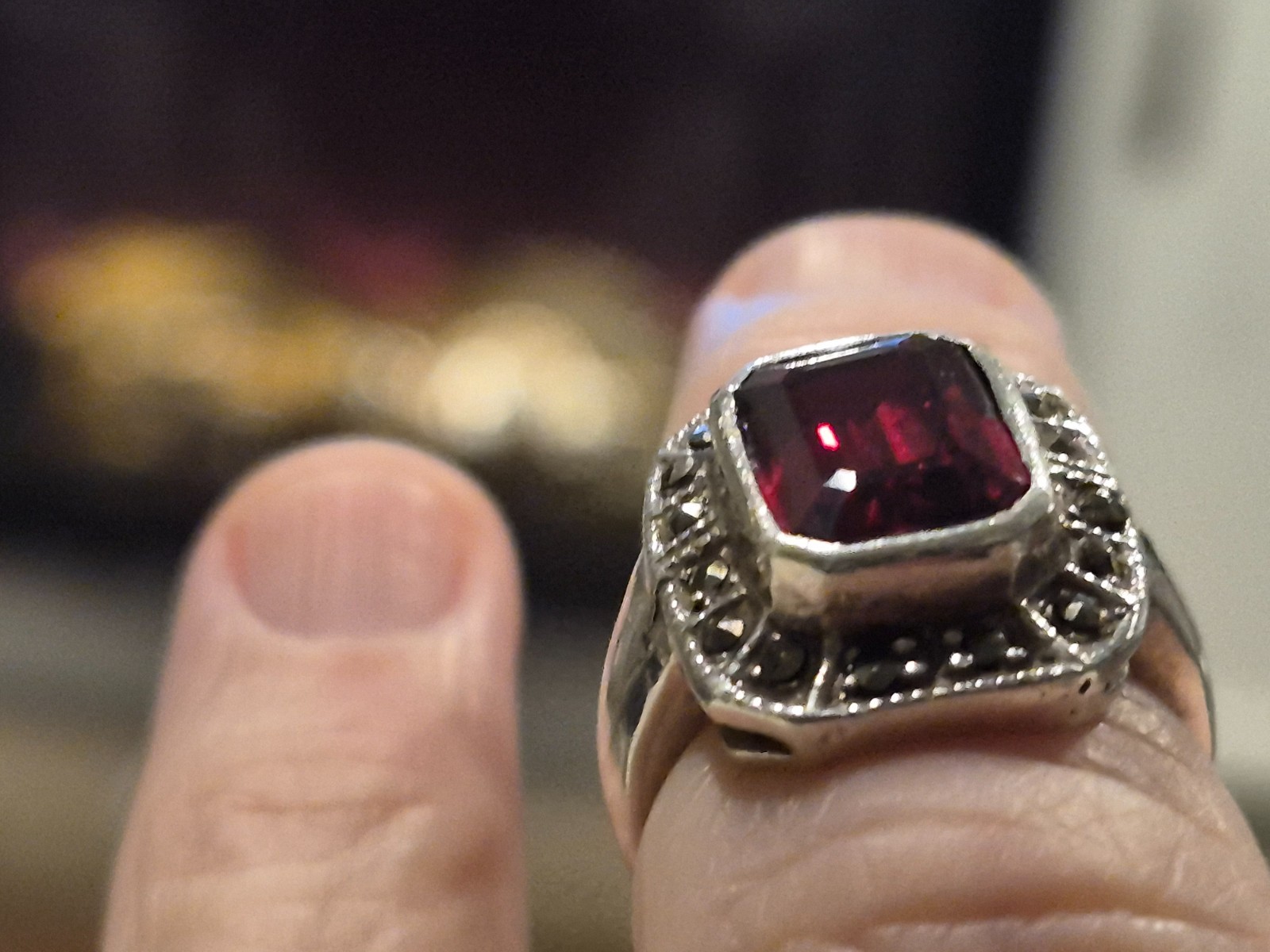 Art Deco garnet sterling silver ring with miniature stones surrounding the garne