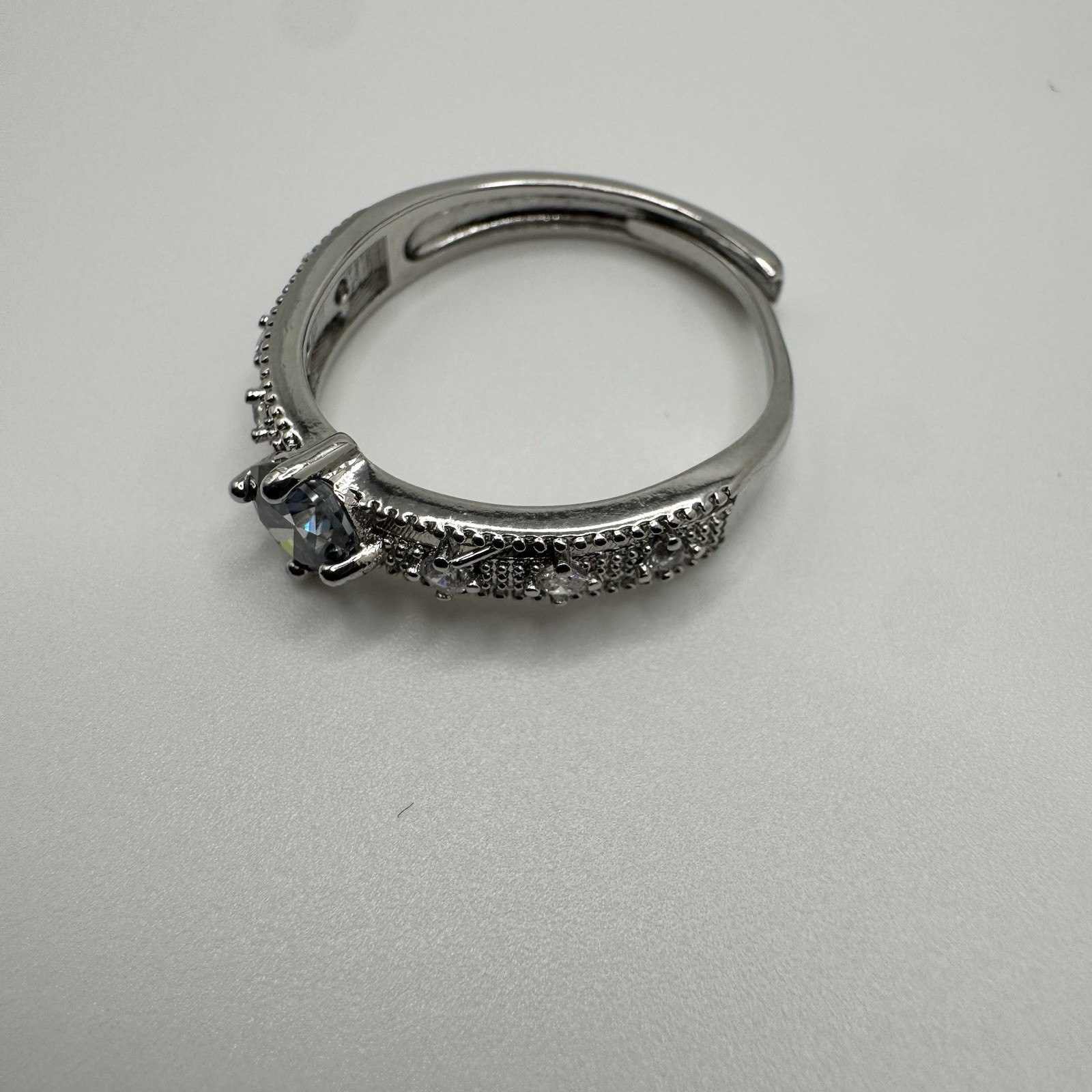 Vintage Style Silvertone Adjustable Ring With Blue CZ Stone