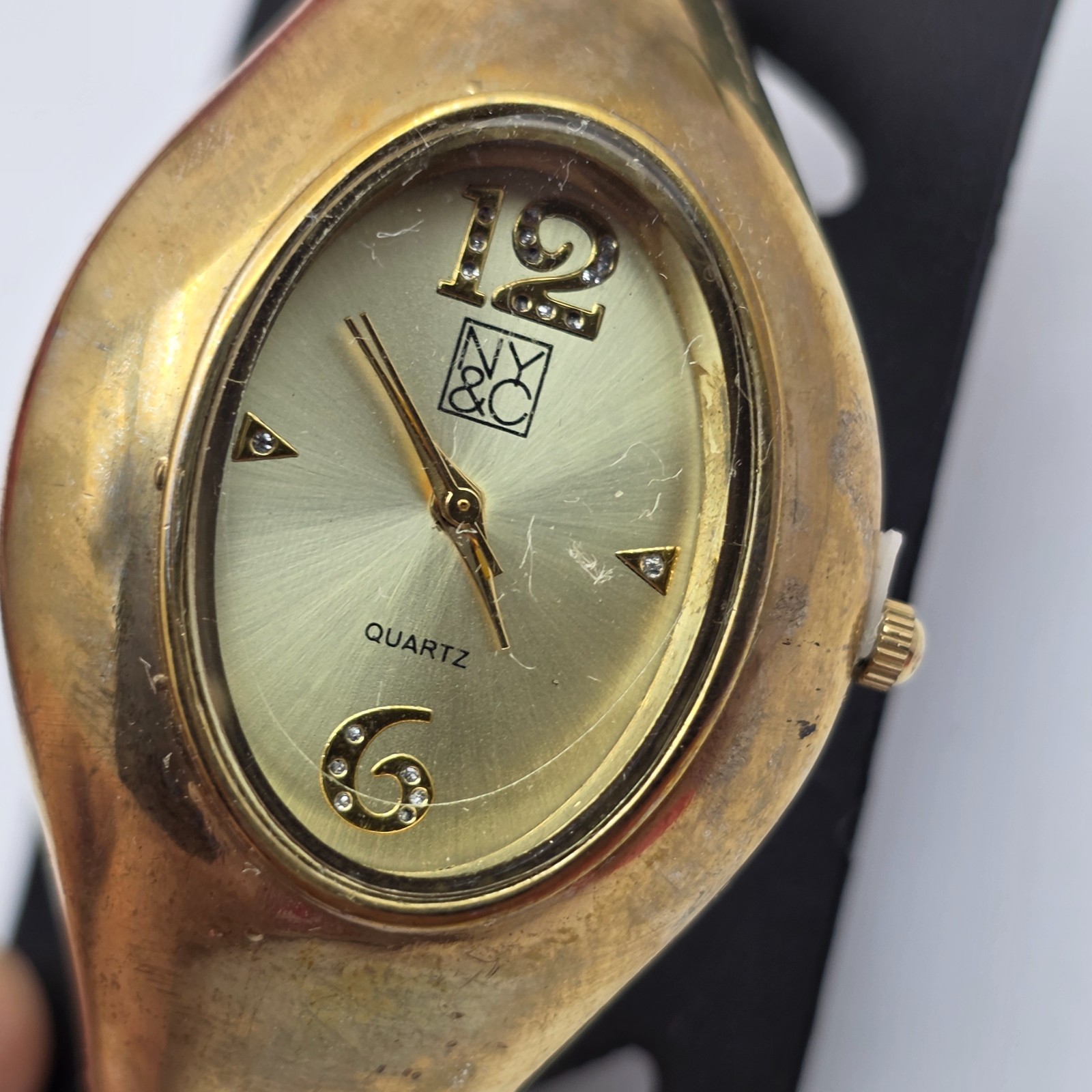 NY & Co Gold Tone Clamper Watch 35mm Cuff Bracelet 6.5 in Quartz Oval New w/Tags