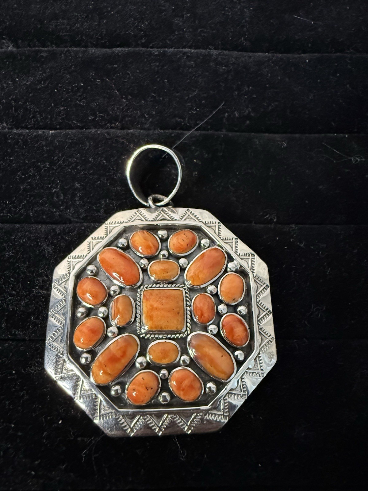 Handcrafted authentic Kenneth Jones Navajo orange spiny cluster pendant