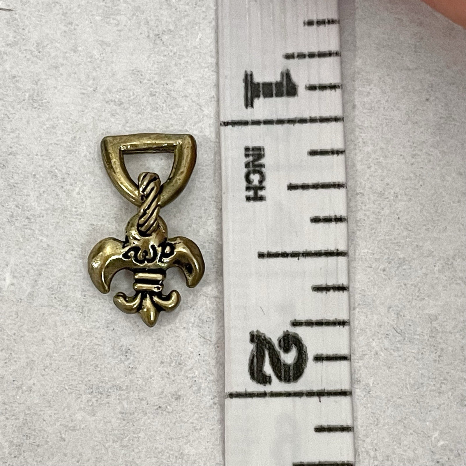 Waxing Poetic Brass Fleur de Lis Small Charm