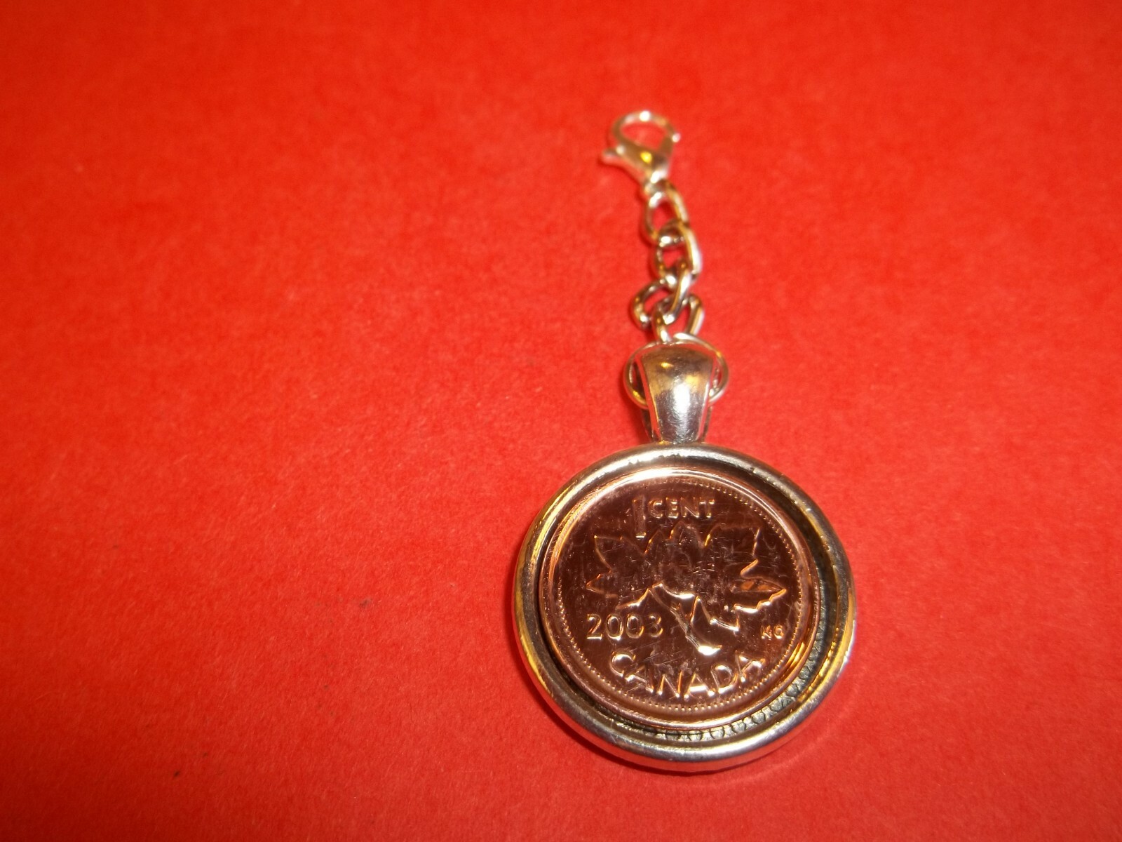 PENNY COIN – ONE (1) CENT – CANADA SILVER CASED HANDBAG PENDANT – 1997 to 2011