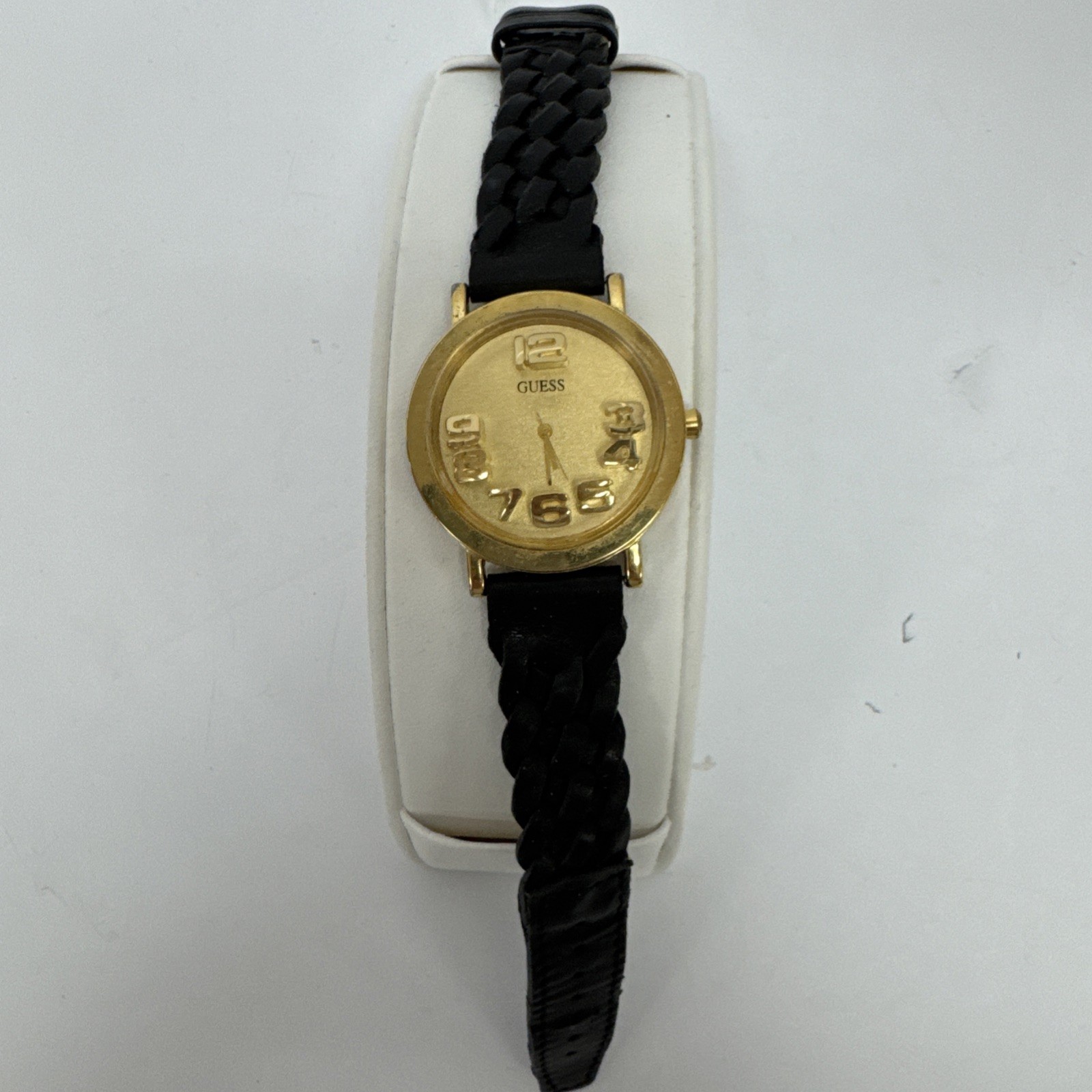 Vtg Guess watch gold-tone & raised 3D numbers and a black braided leather band.