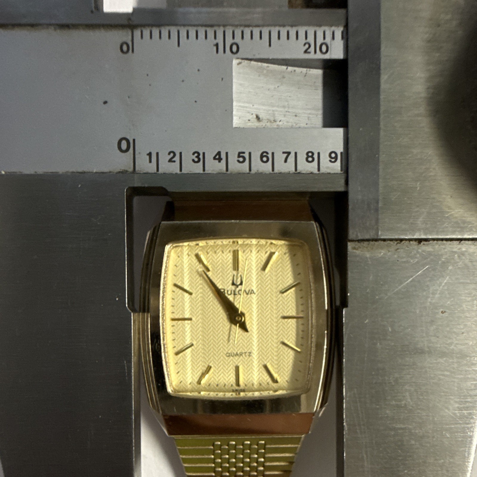 Bulova Quartz Rectangular Silver Herringbone Dial Dress Watch – 06